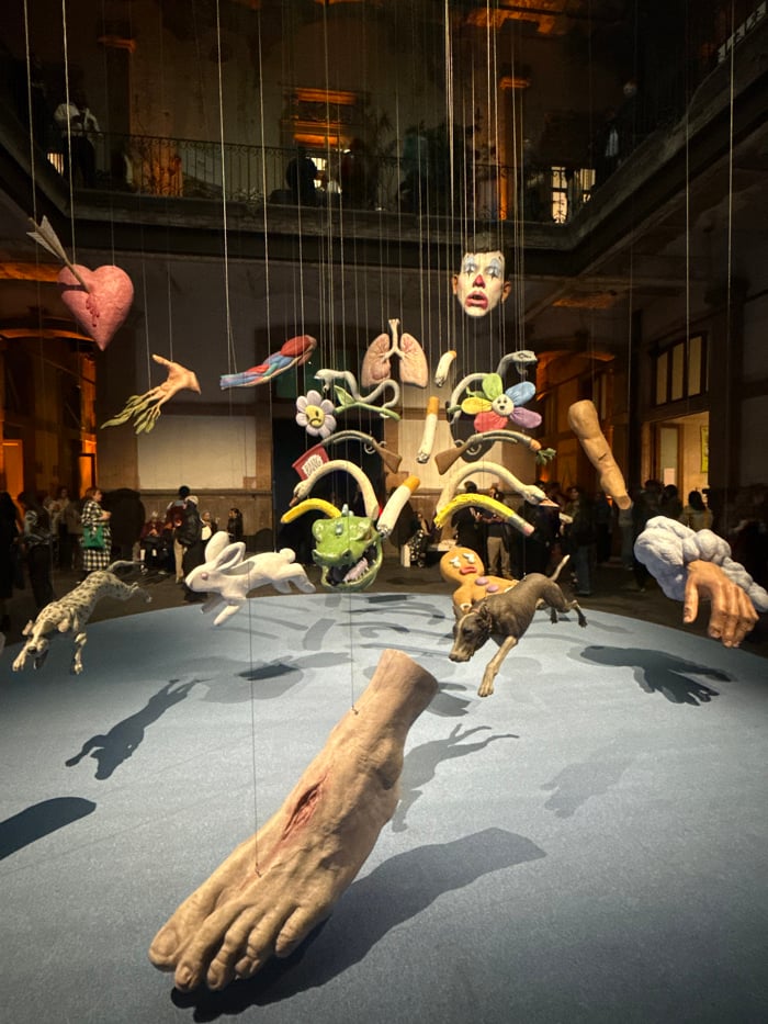 Art gallery visitors fist bump at Mexico City installation