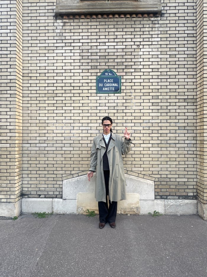 Young man documents afternoon photo session near Paris architecture