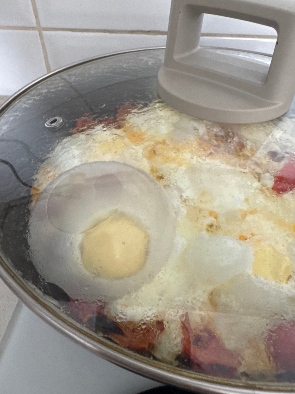 Food cooking in a covered pot on a Bat Yam stovetop