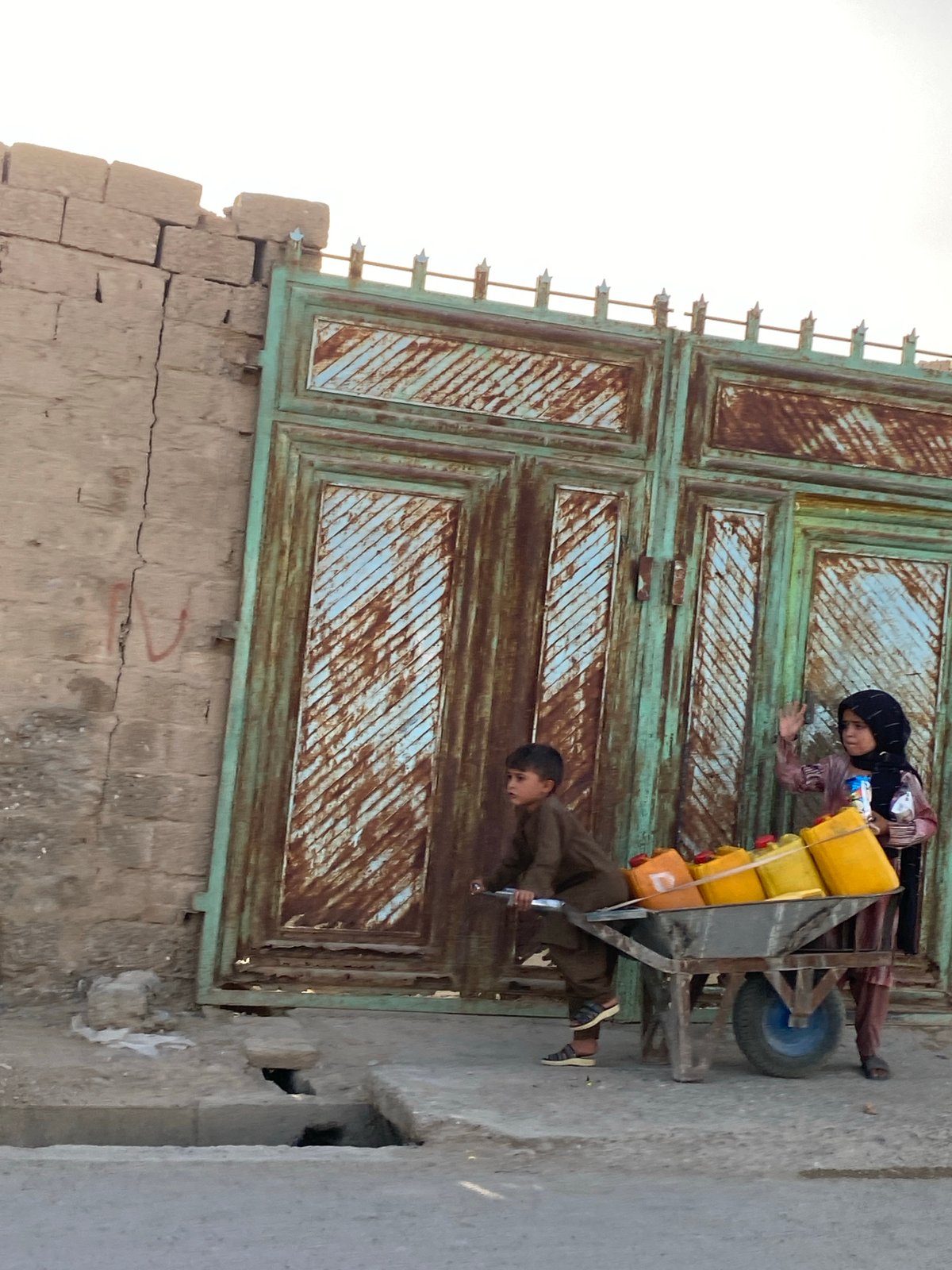 Daily life on Kandahar's streets, jerrycans and dusty roads