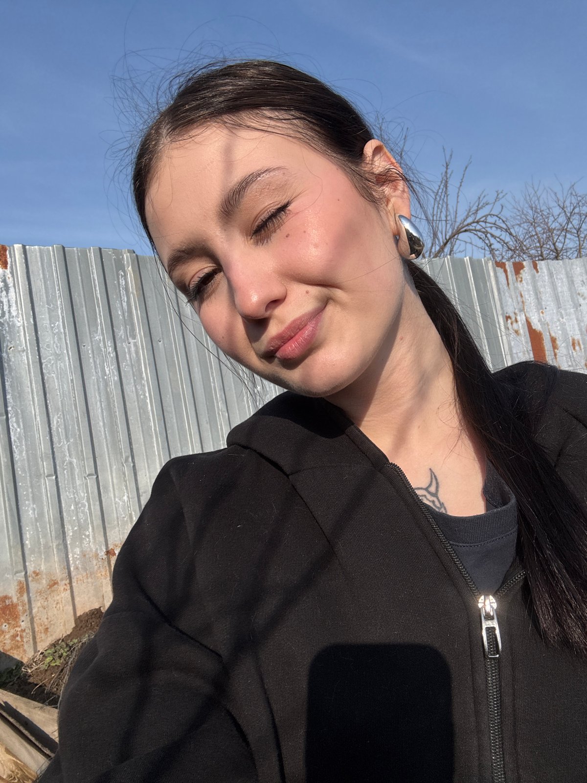 Woman and gray cat spotted in Foki, Russia yard