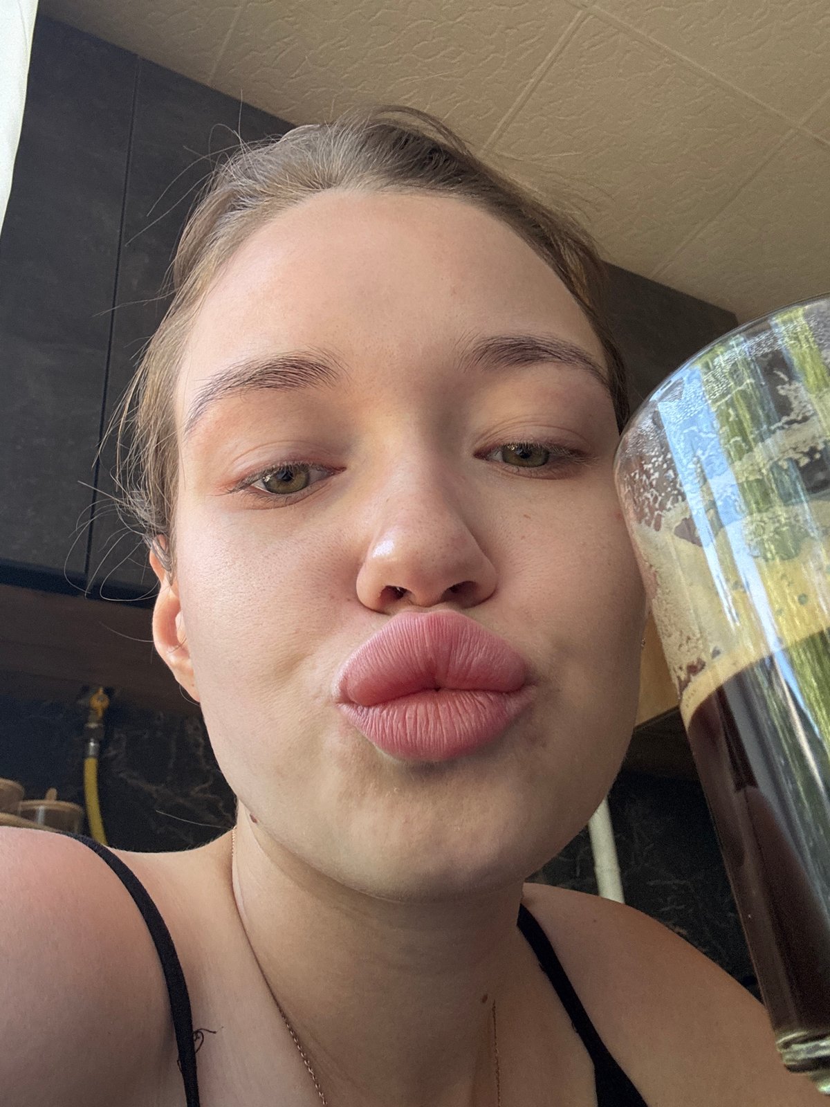 Woman documents morning routine in Chaikovsky kitchen