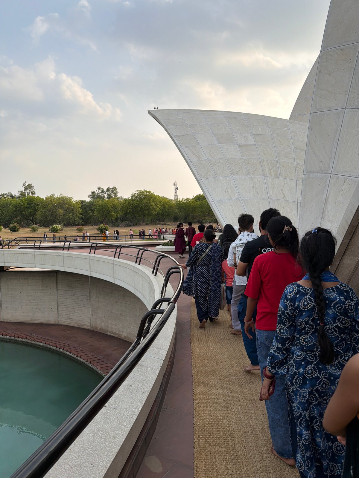 Visitors tour Lotus Temple in Delhi during midday visit