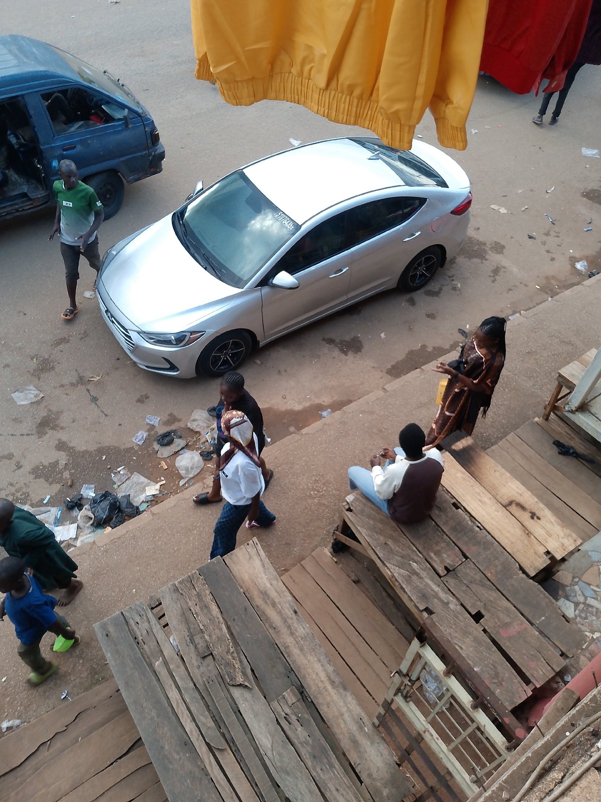 Everyday street commerce and foot traffic in Bukuru, Nigeria