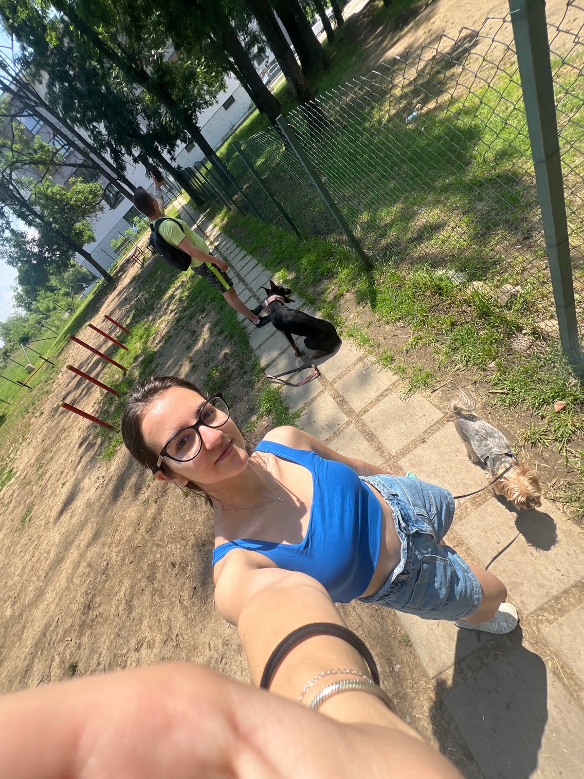 Couple enjoys sunny morning dog walk in Sofia park