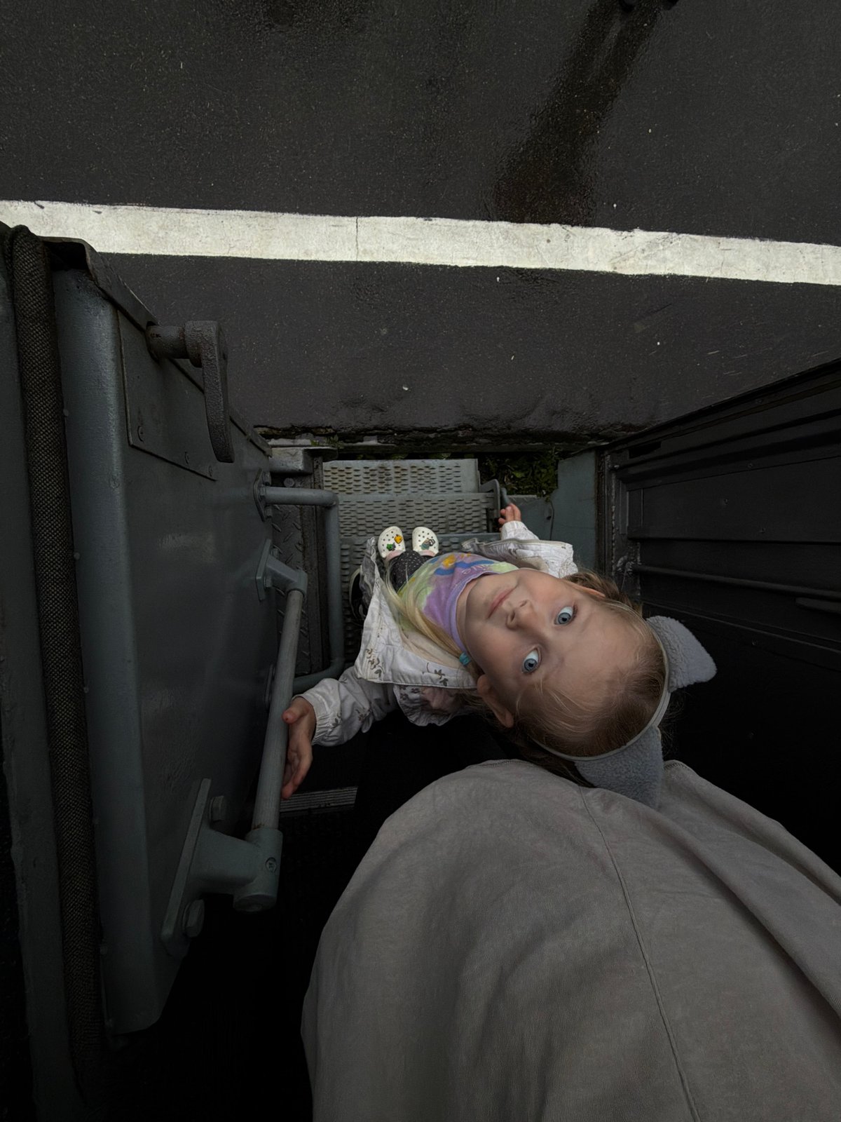 Rainy train stop at Uzunovo station with a child boarding
