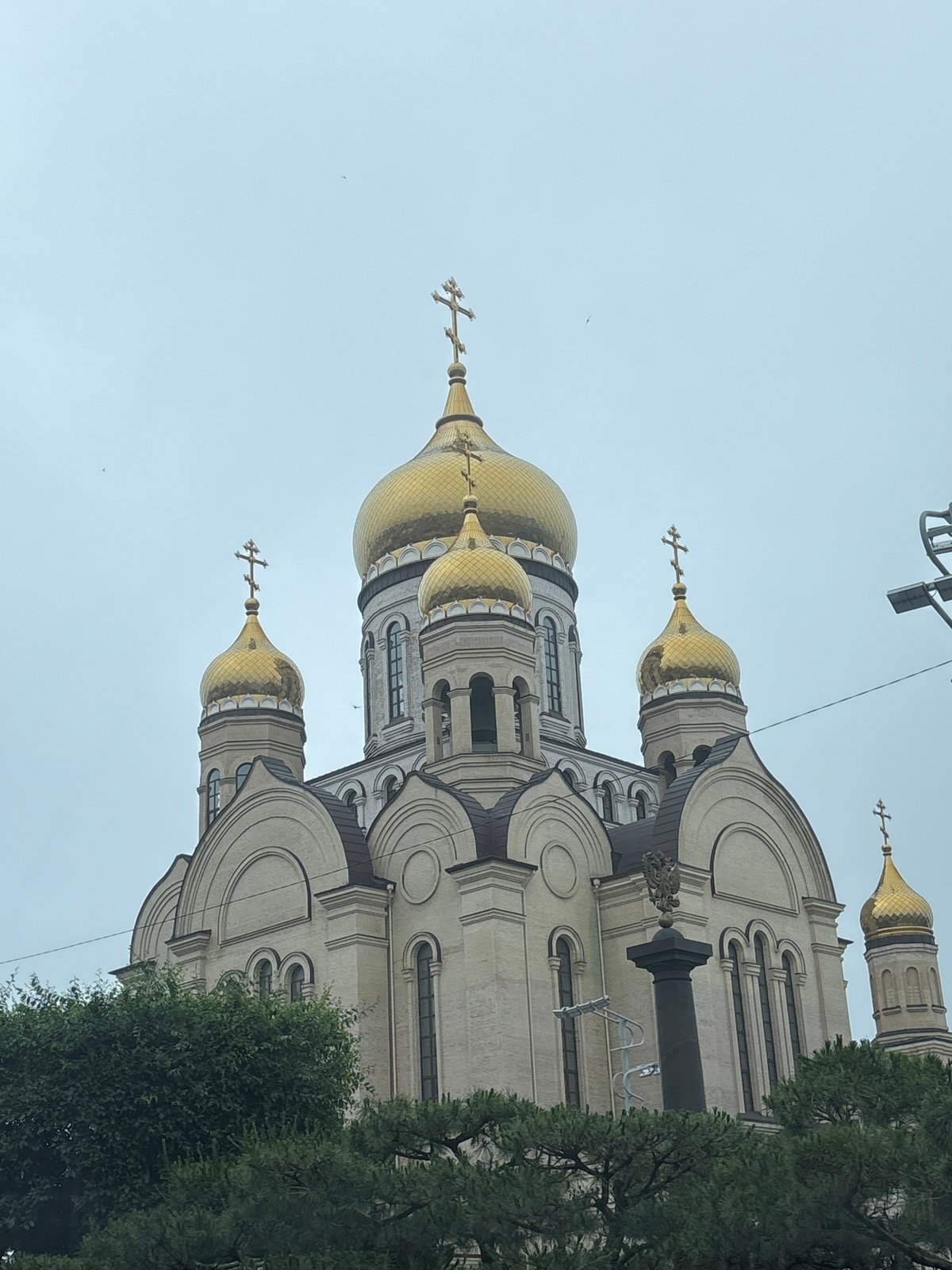Vladivostok's Transfiguration Cathedral under a pale overcast sky
