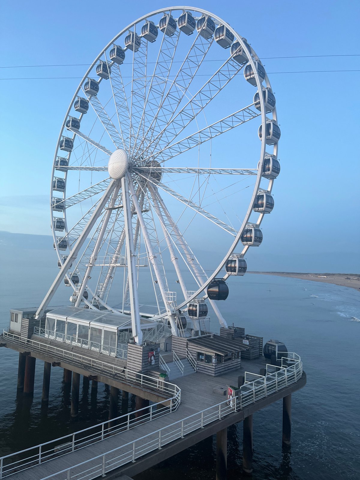 Sunset beach scenes with art installation in The Hague