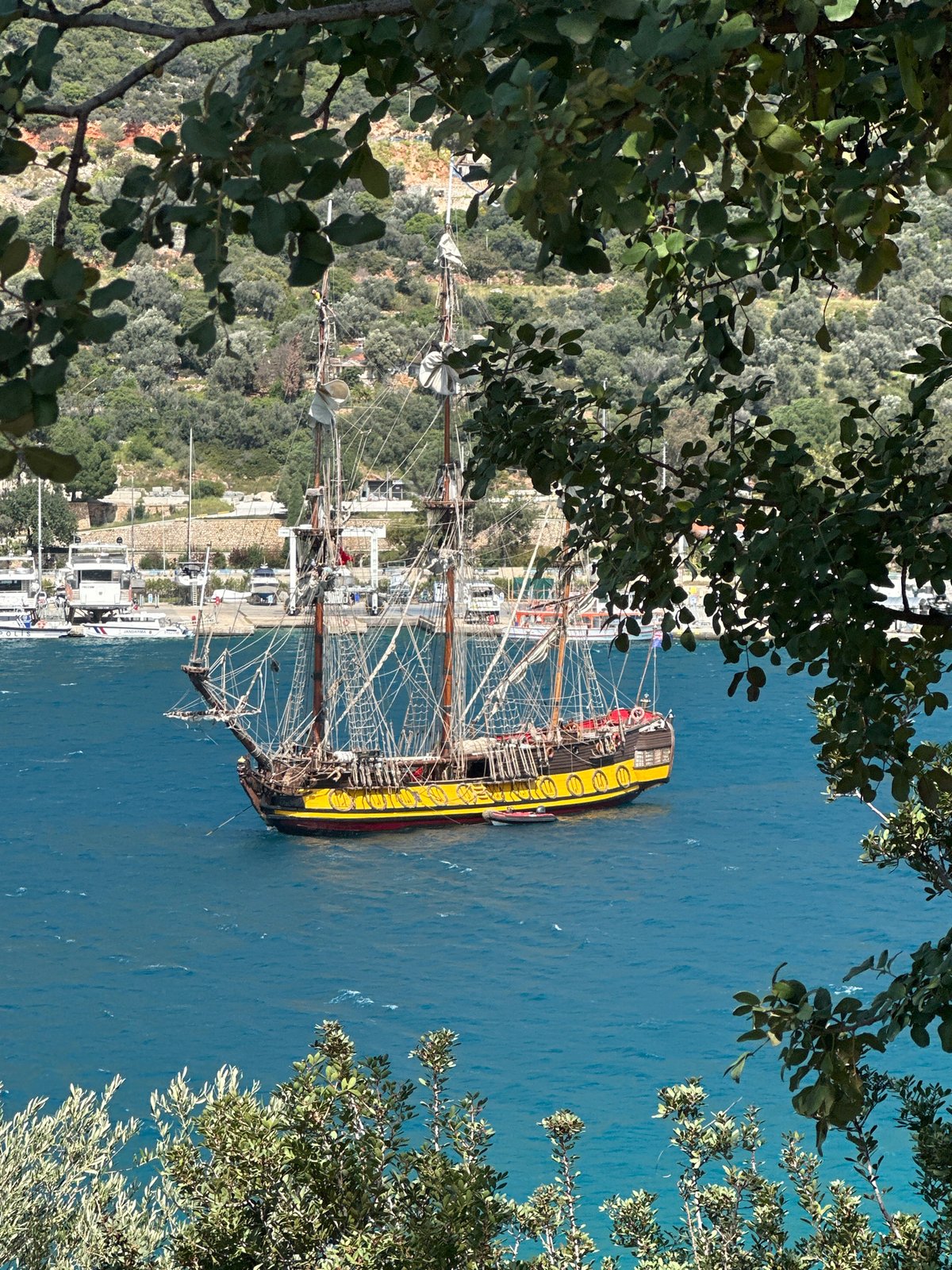 Traditional sailing ship docks at Turkish Mediterranean harbor