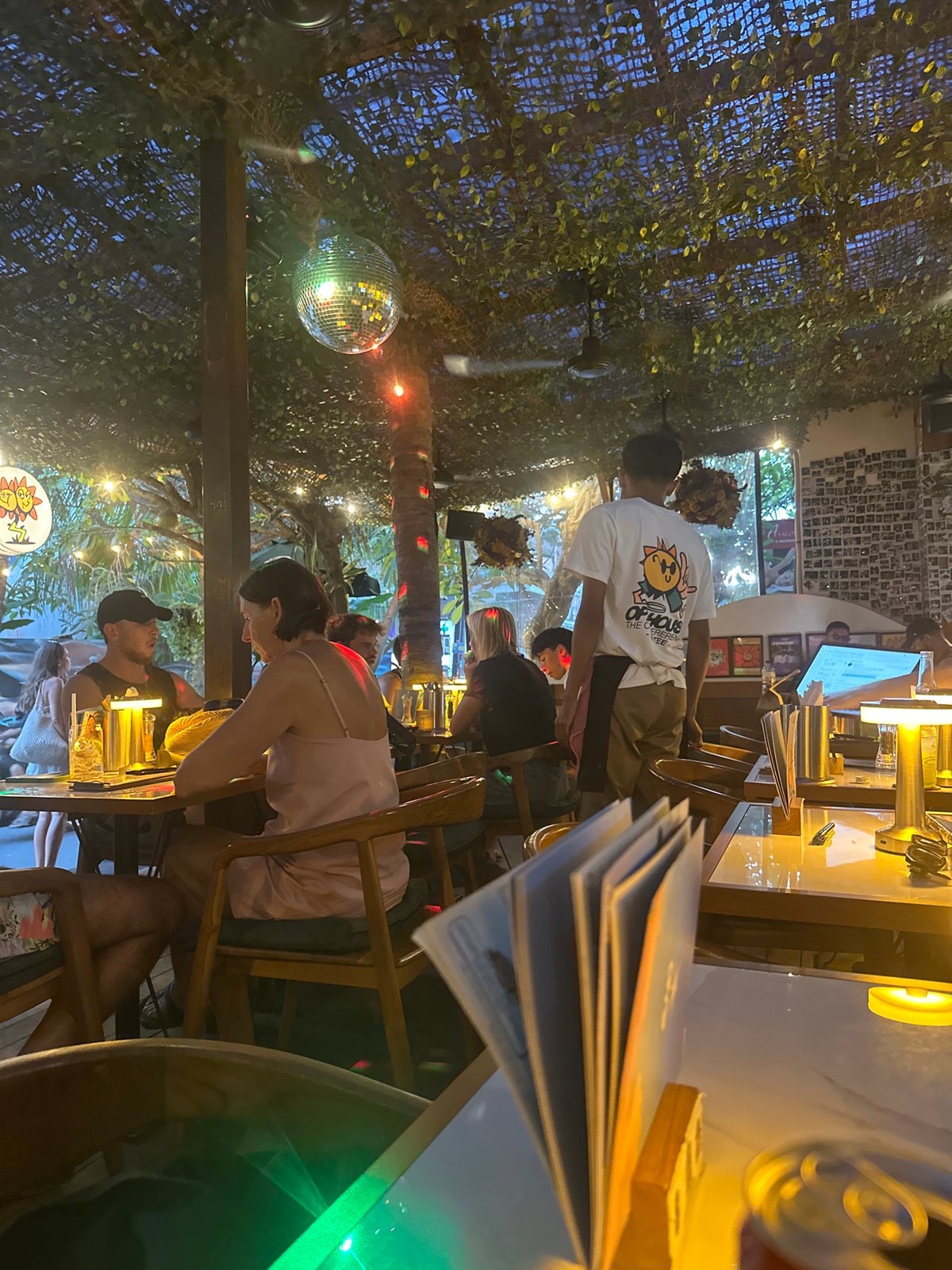 Burgers, fries, and cheesecake at a Mengwi restaurant
