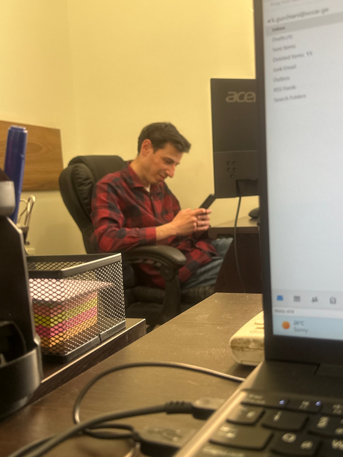 Office worker photographed during casual workplace session in Tbilisi