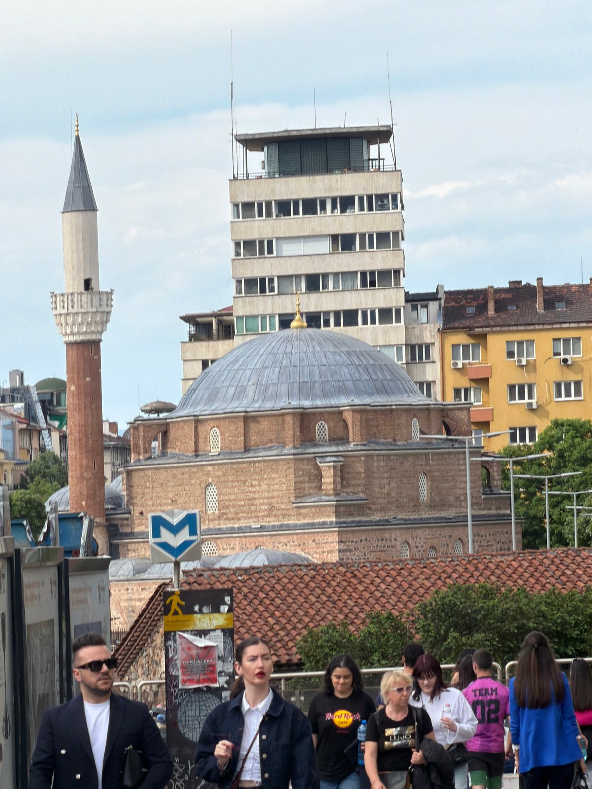 Tourist documents Sofia landmarks and street life during afternoon walkabout