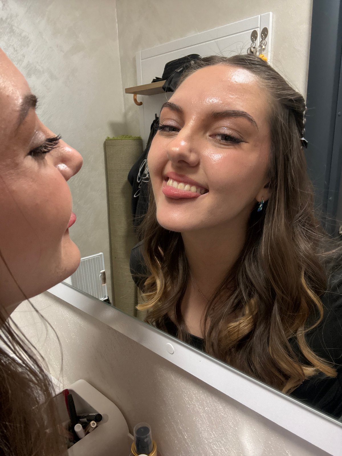 Woman takes playful mirror selfies in Sofia bathroom
