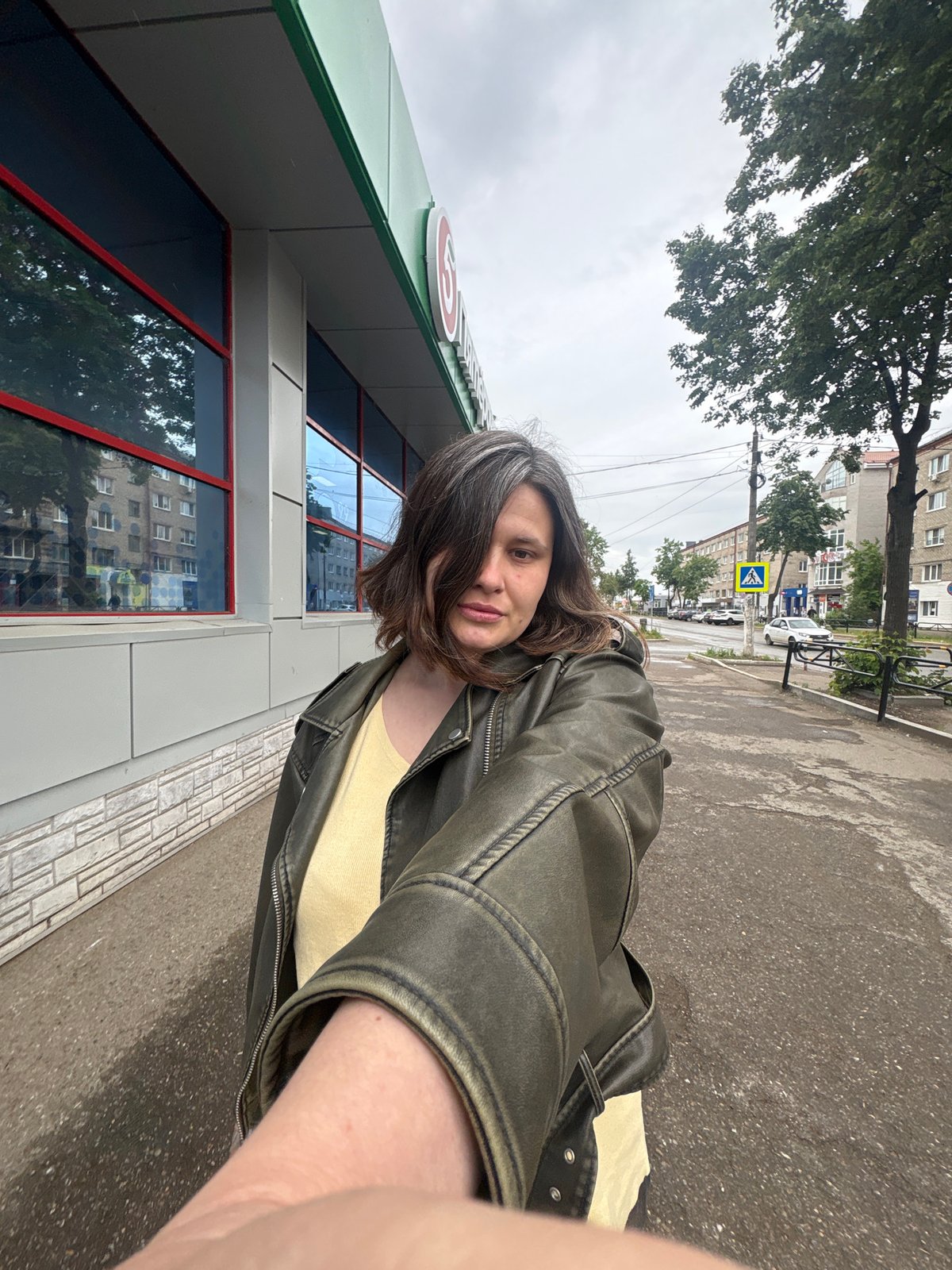 Morning selfies captured on overcast streets in Chaikovsky, Russia