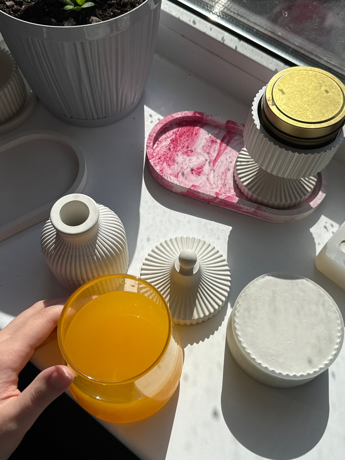 Person with orange juice documented across multiple indoor locations