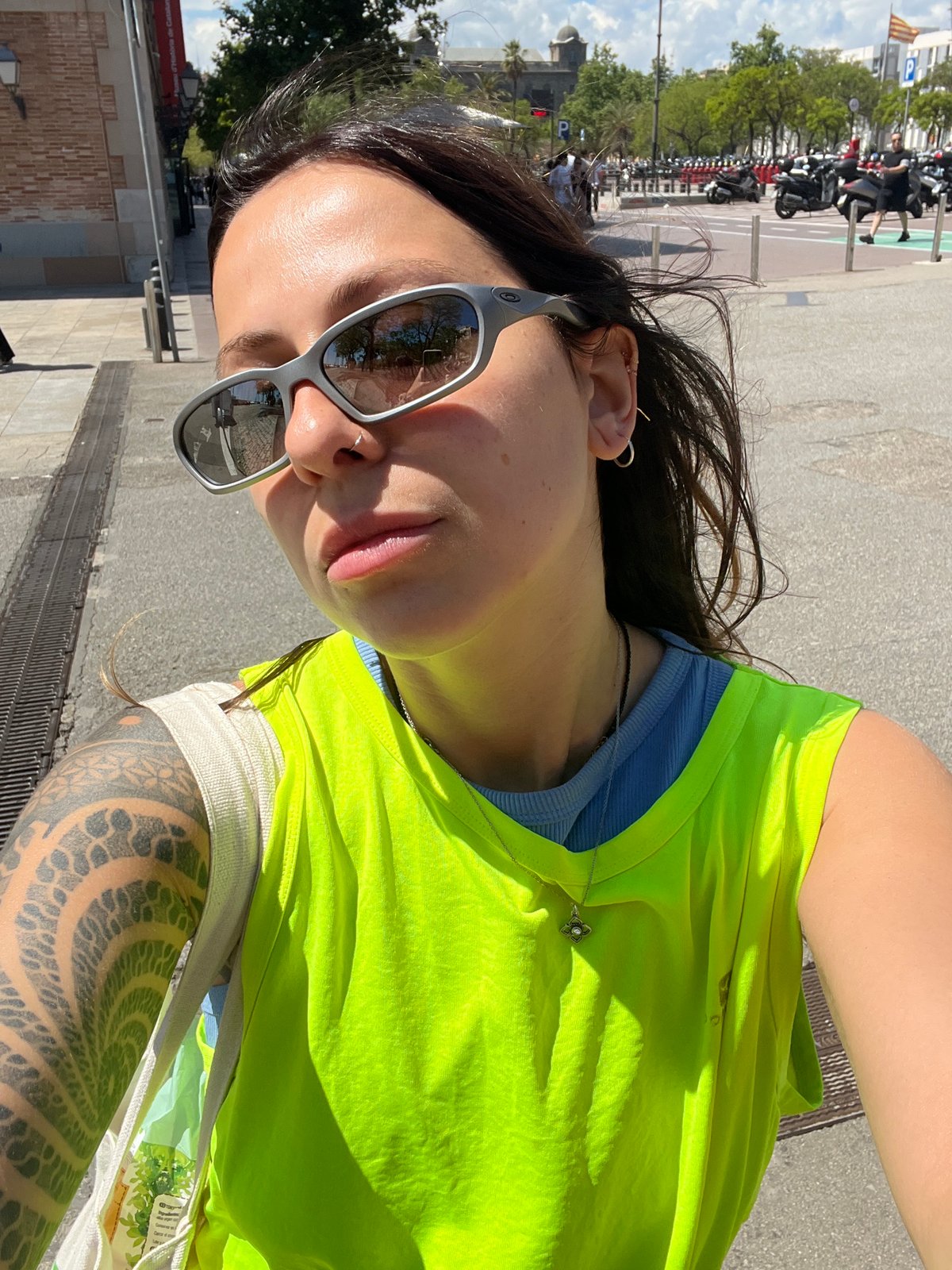 Woman takes multiple selfies around Barcelona during afternoon outing
