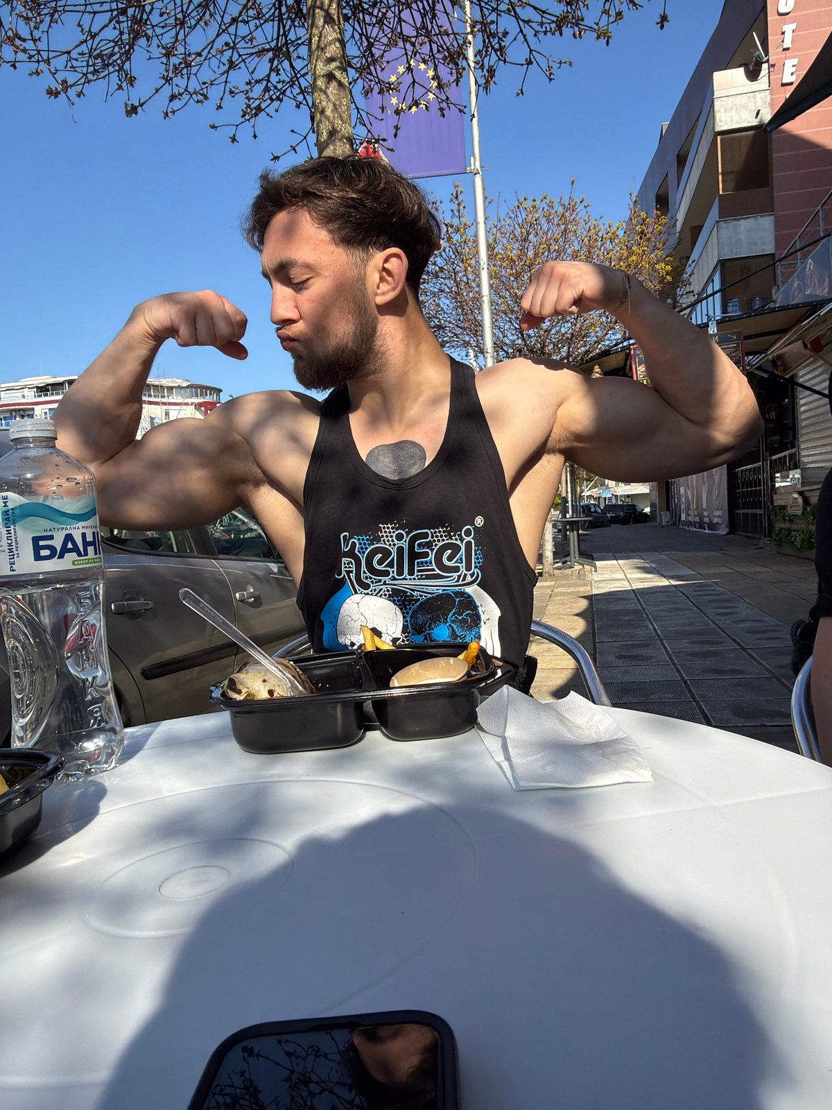Men dining outdoors in Primorsko, Bulgaria
