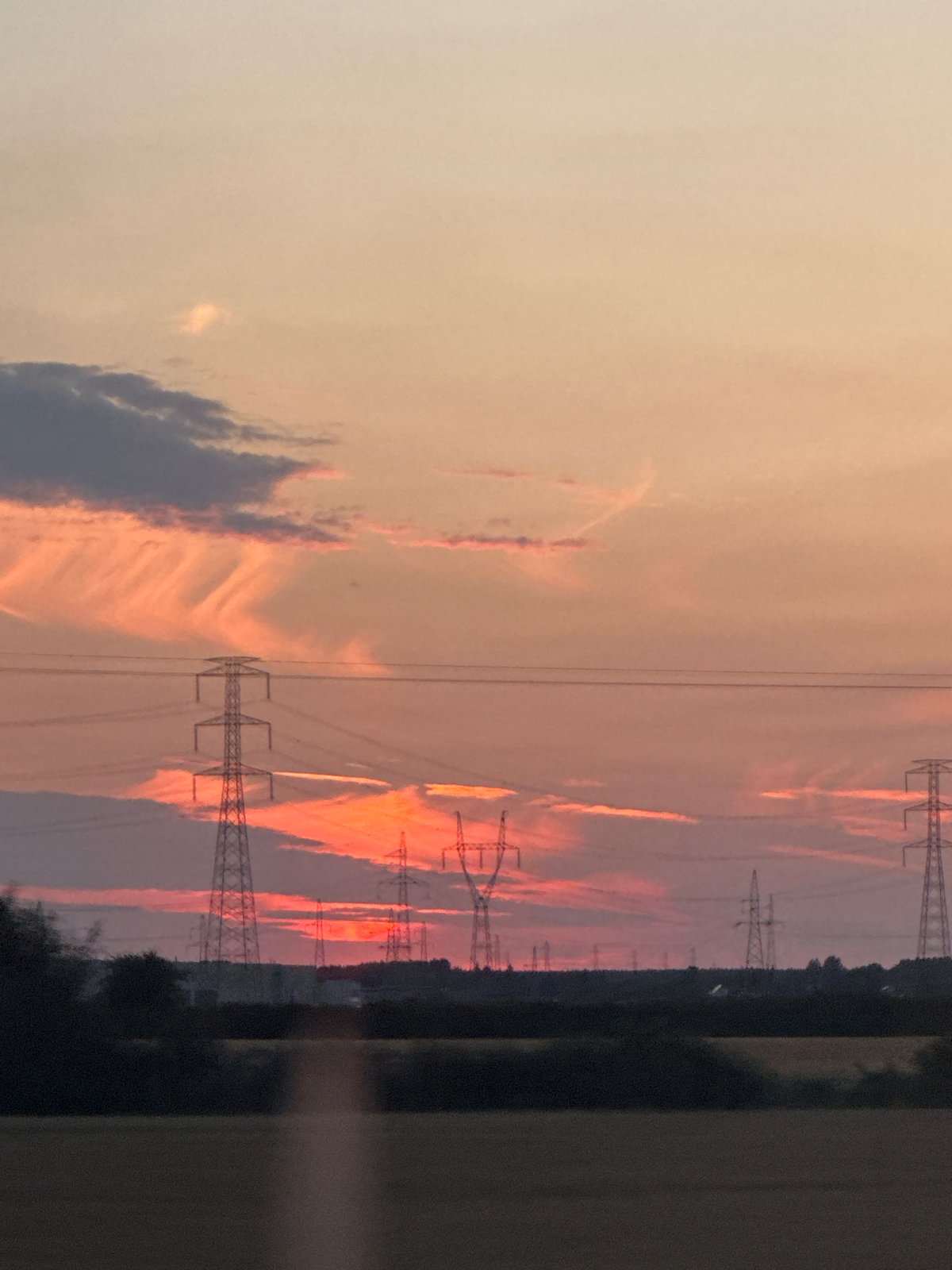 Sunset over Poznań's countryside, seen from a moving train