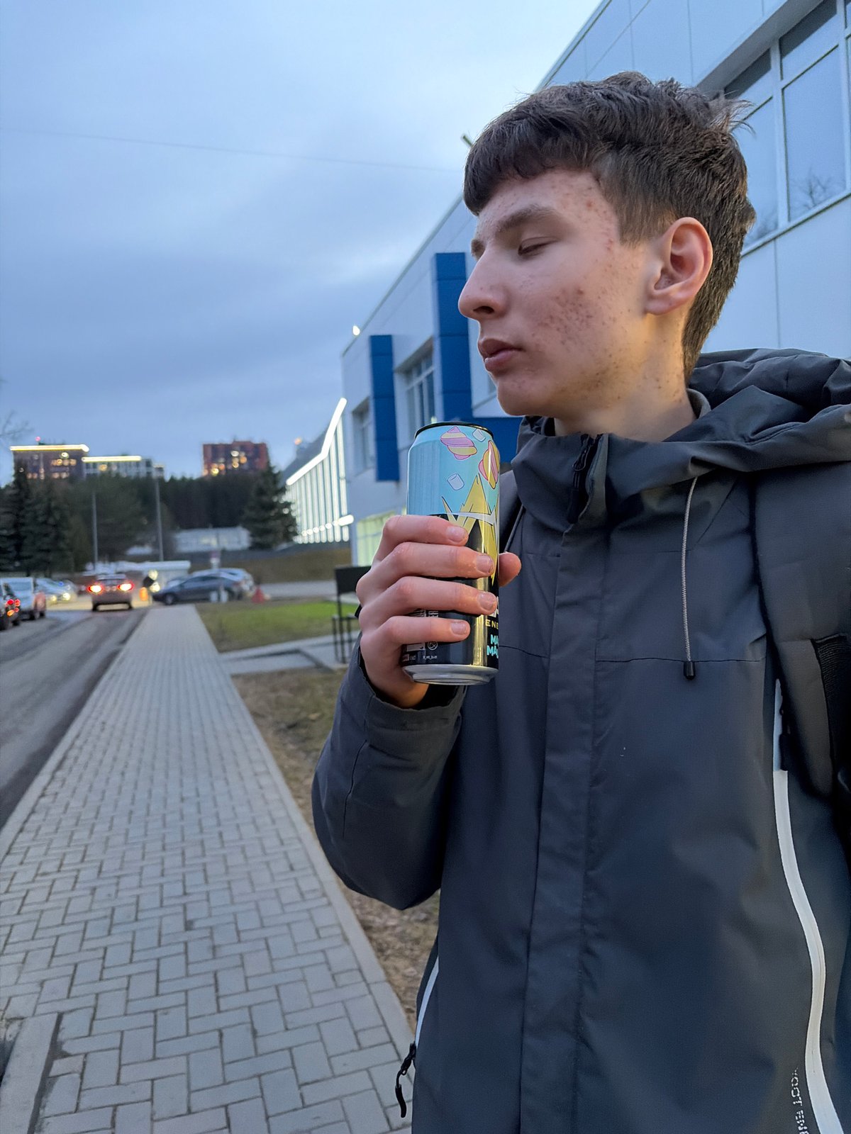 Young couple explores Izhevsk, snacking on pastries and cheese puffs