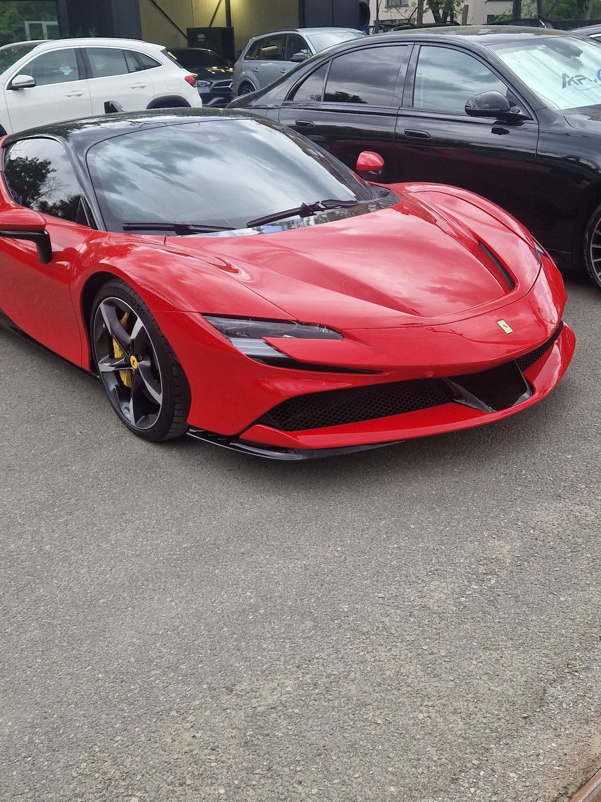 Ferrari spotted parked near pedestrian with bag