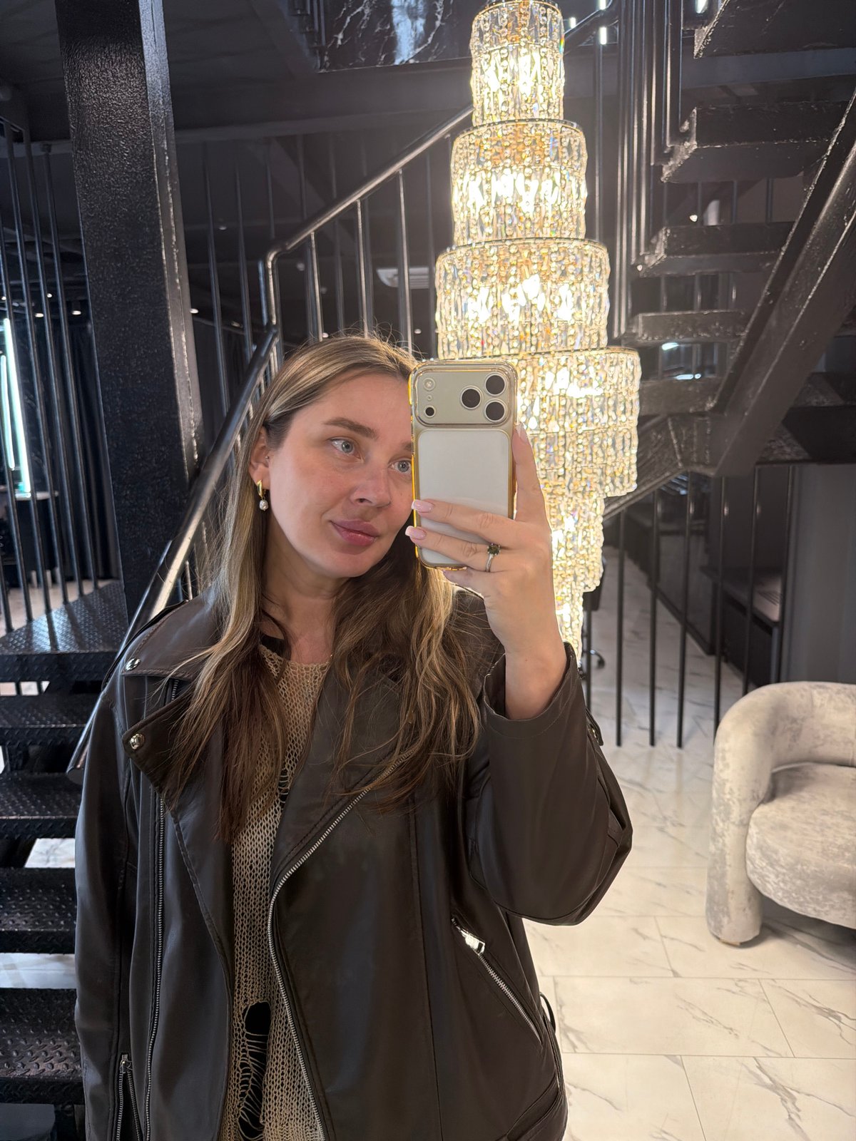 Woman takes selfies in upscale Moscow interior space