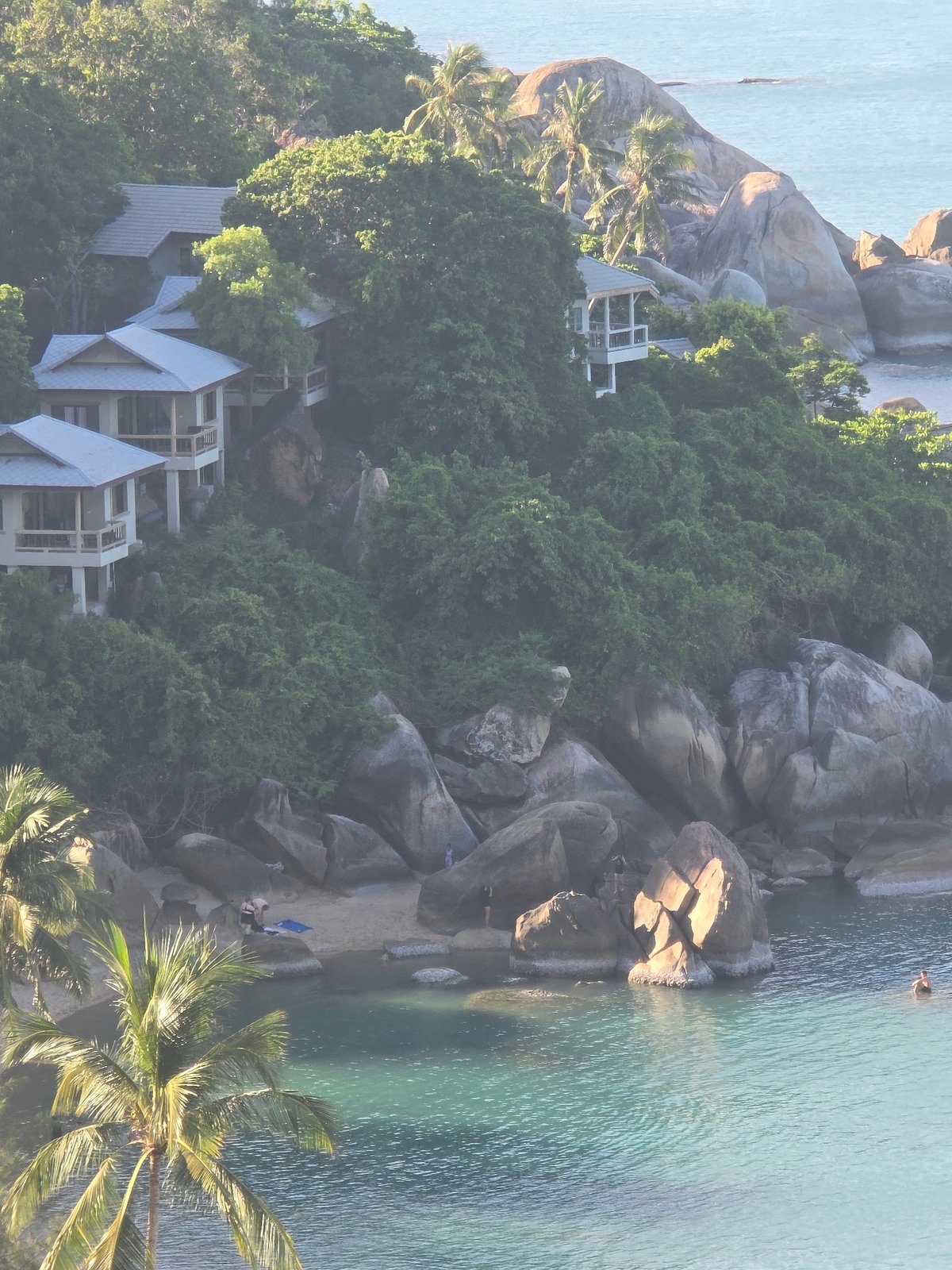 Hillside resort and ocean views on a tropical summer morning