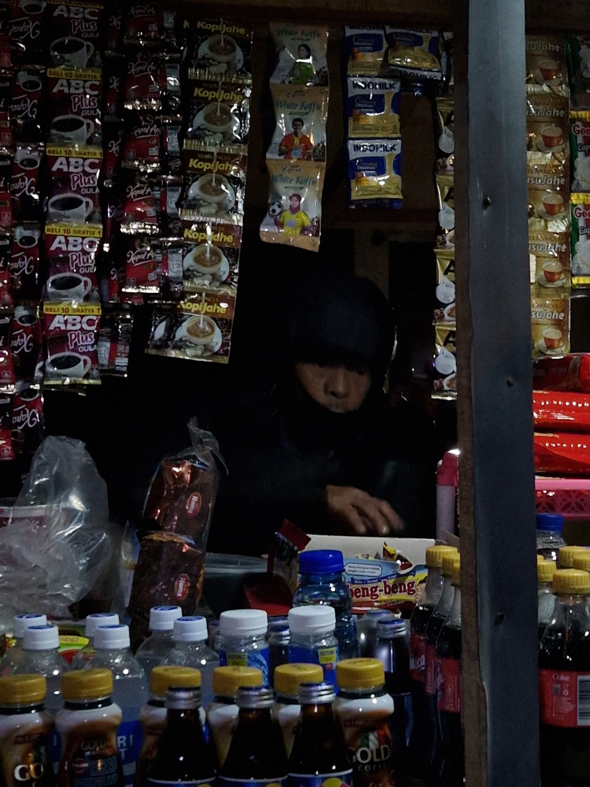 Person spotted in dimly lit shop in Indonesia
