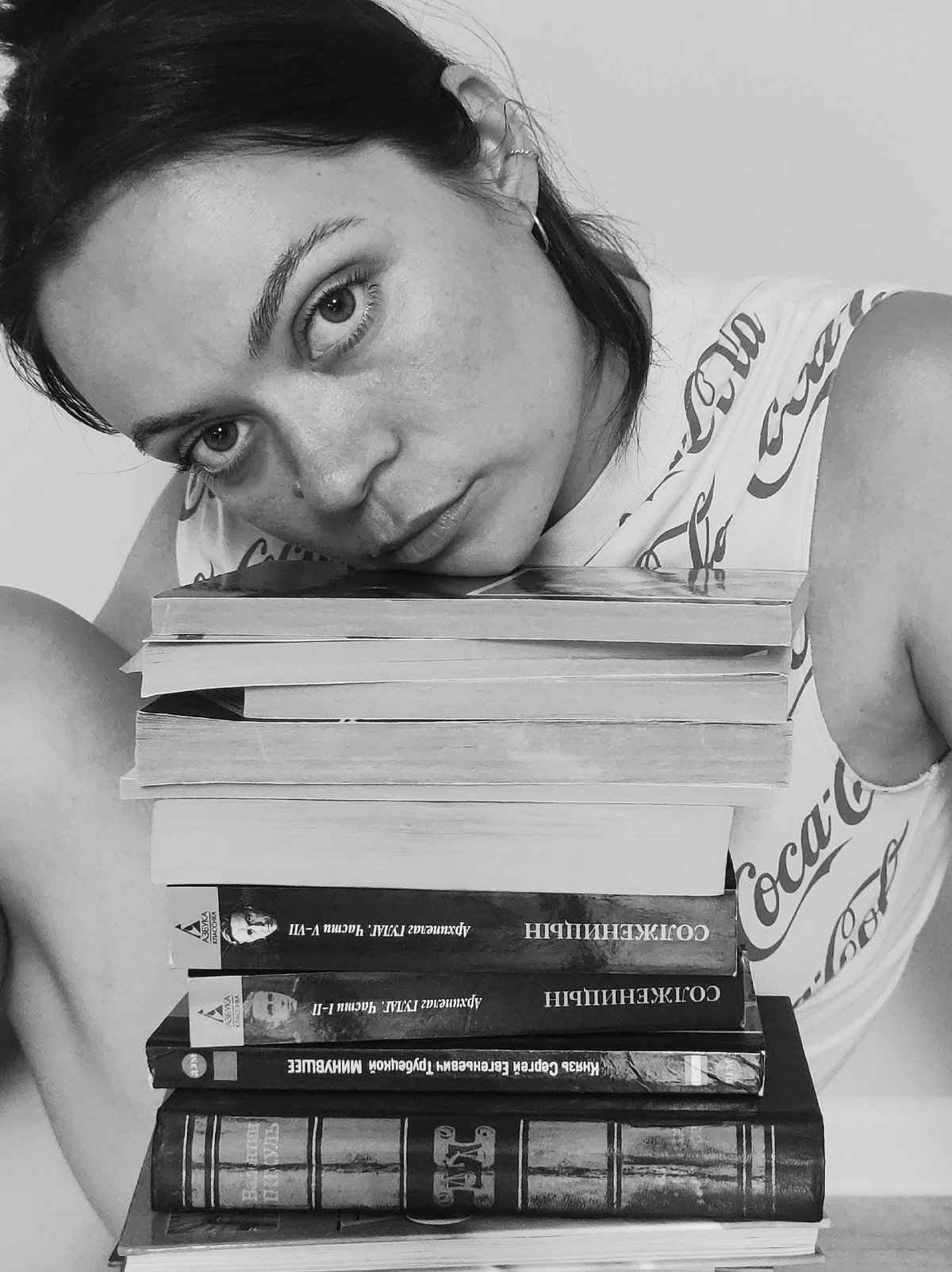Quiet domestic moments captured: woman, children, books at home