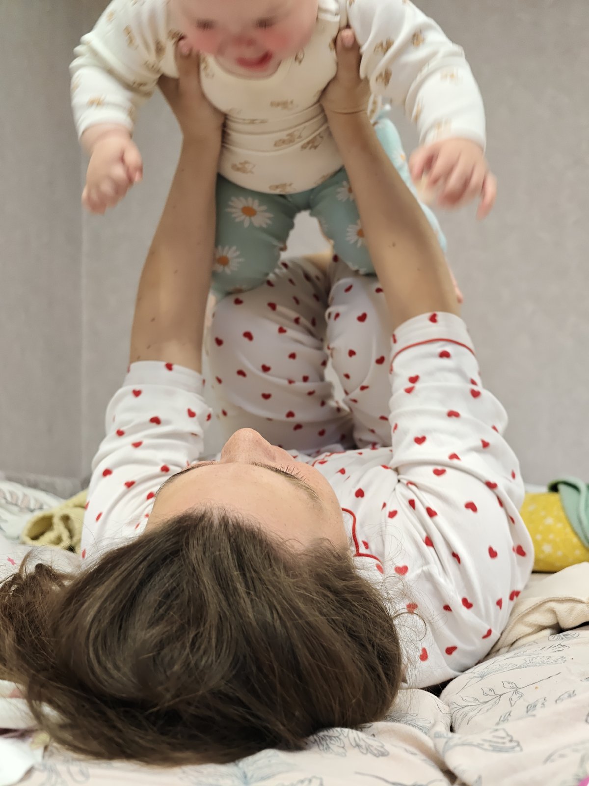 Mother and baby share playful morning moment in Chaikovsky