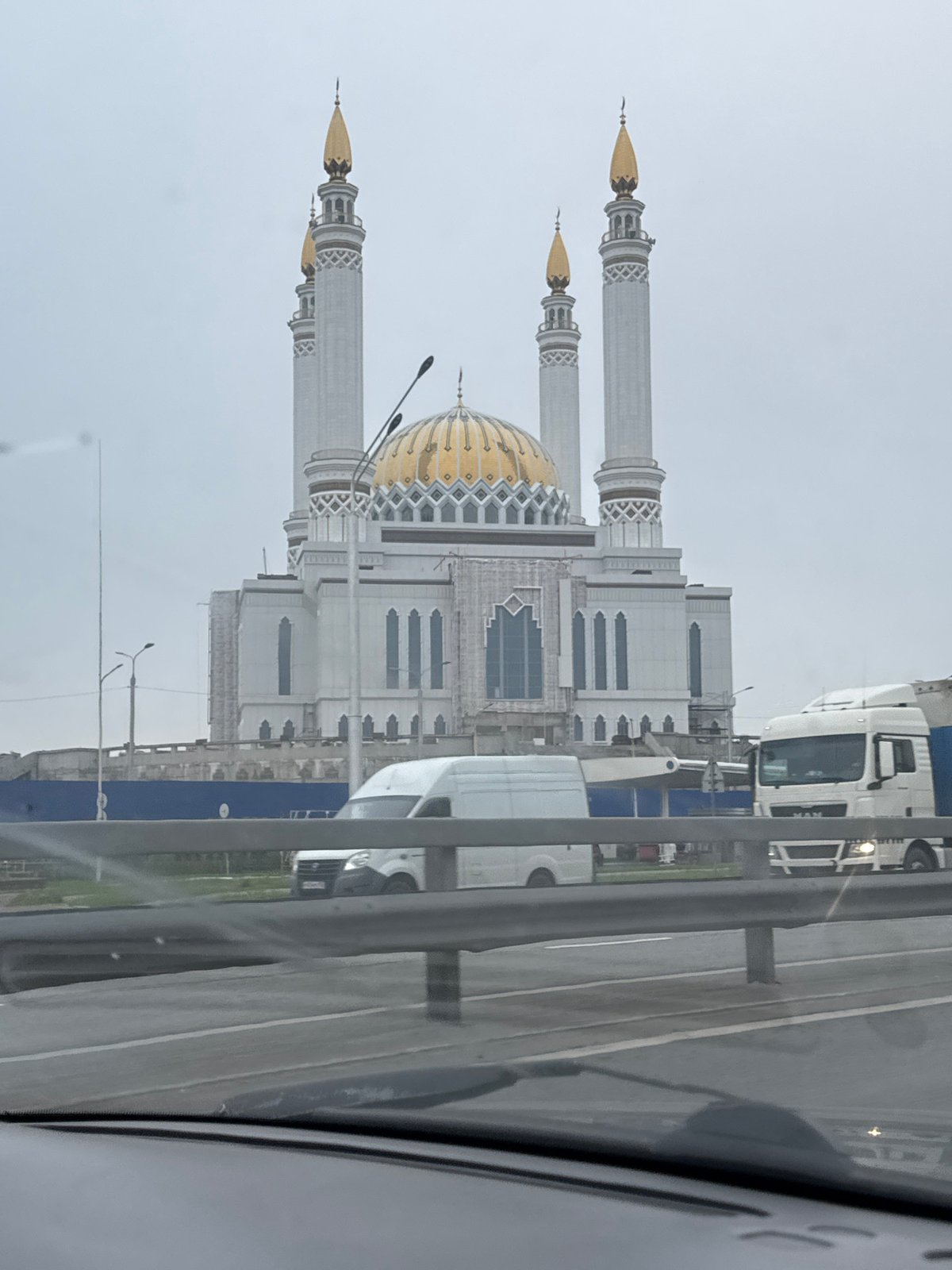 Ufa's prominent mosques, gold domes and minarets under cloudy skies