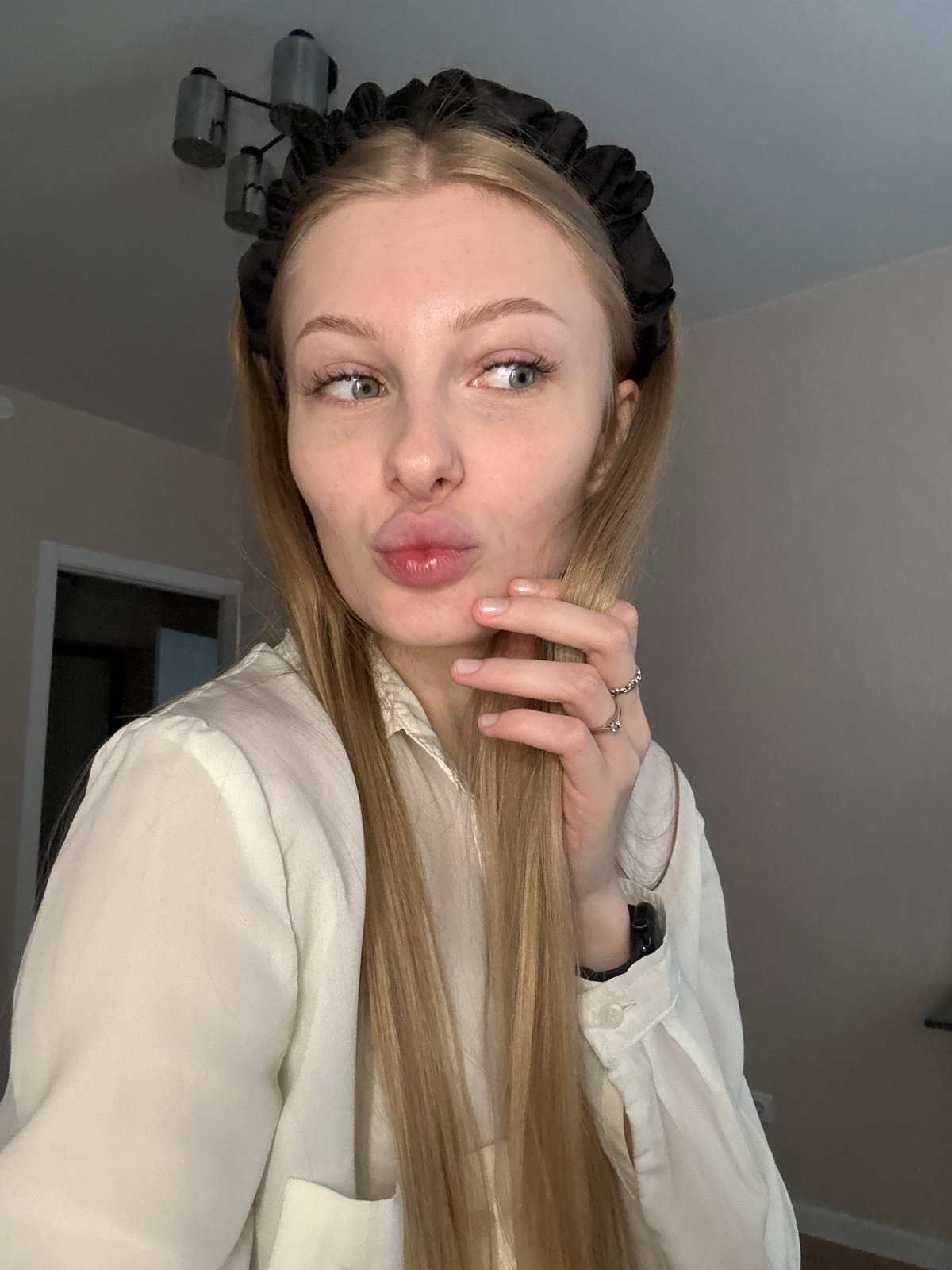 Woman takes selfies during rainy afternoon in Perm