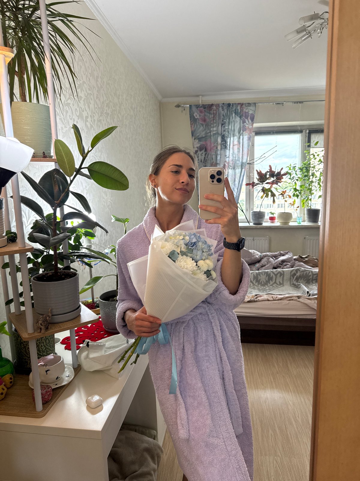 Woman Takes Mirror Selfie With Flower Bouquet in Russia