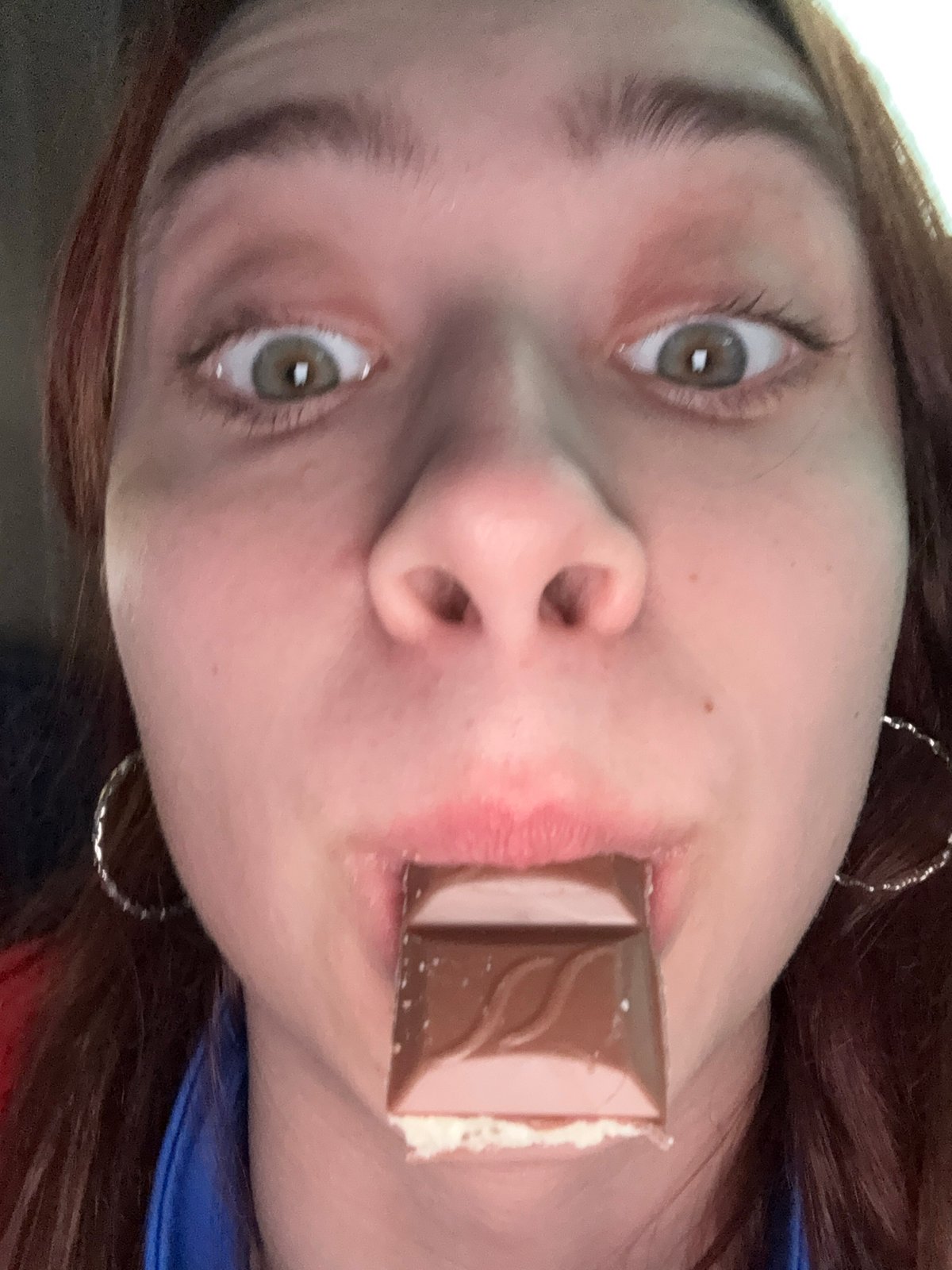 Person photographed eating chocolate bar in Zvyozdny, Russia