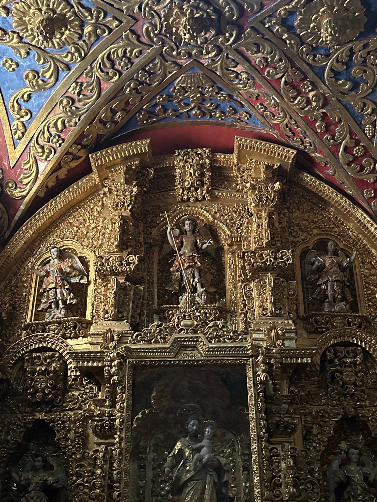 Visitor documents baroque church architecture in Tepotzotlán, Mexico