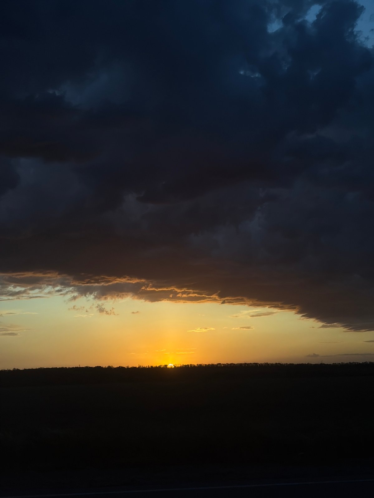 Dramatic sunset creates orange sky display, witnessed May 22