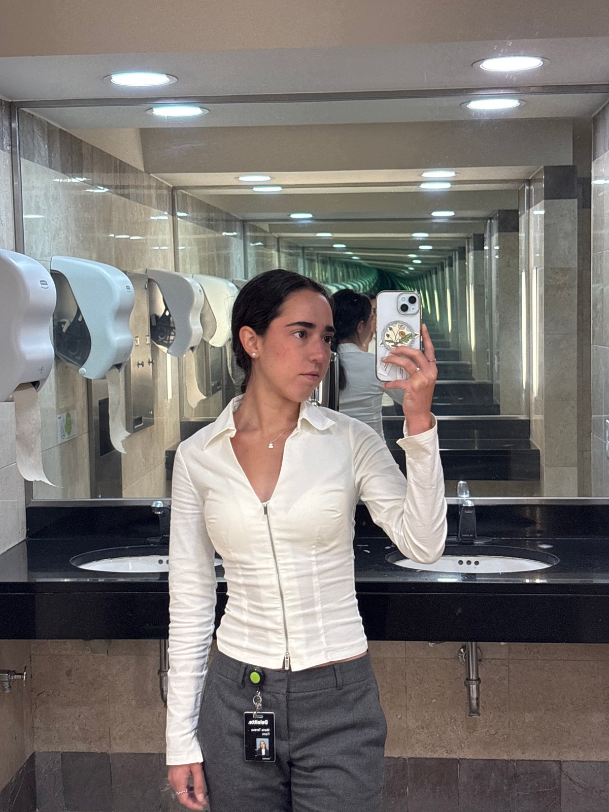 Woman takes selfie in infinity mirror bathroom in Mexico City
