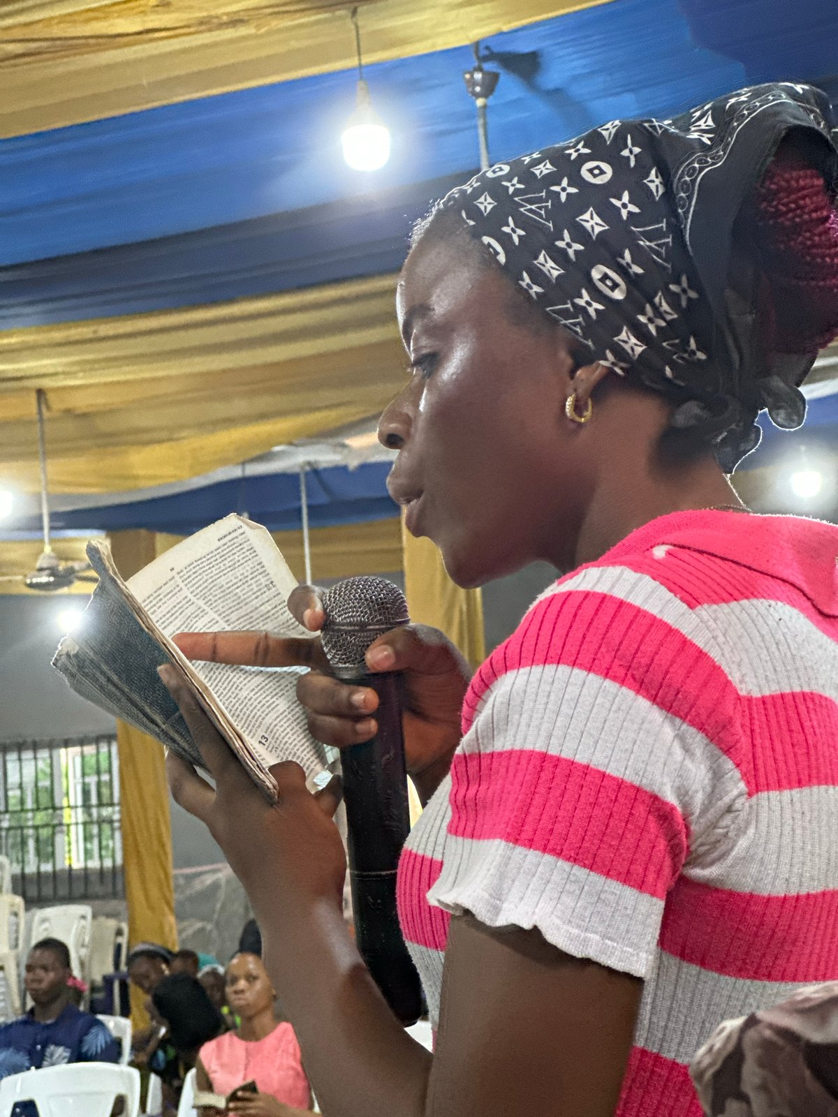 Religious gathering with preaching and music documented in Aba