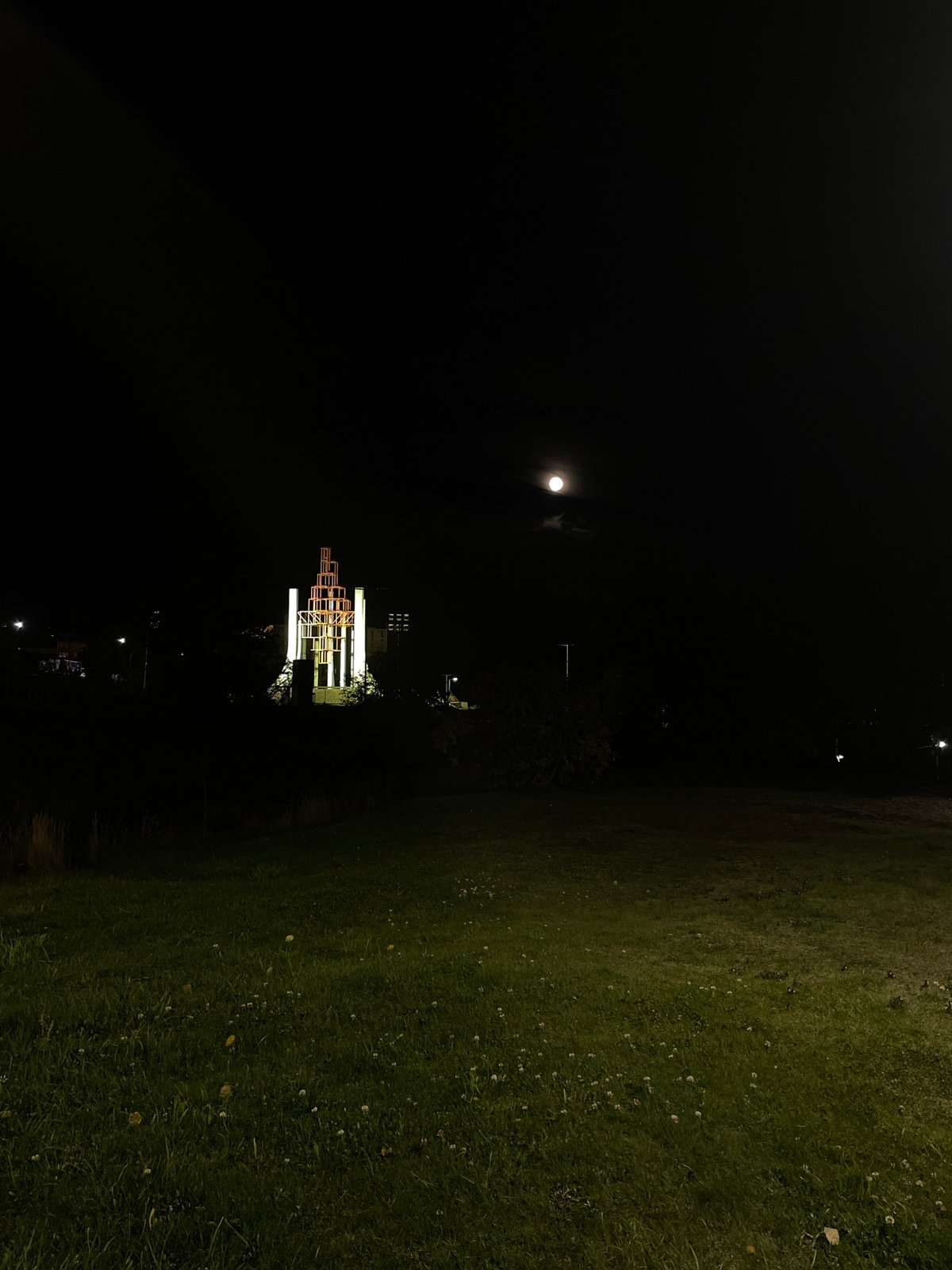 Illuminated geometric sculpture observed during Ushuaia night scene