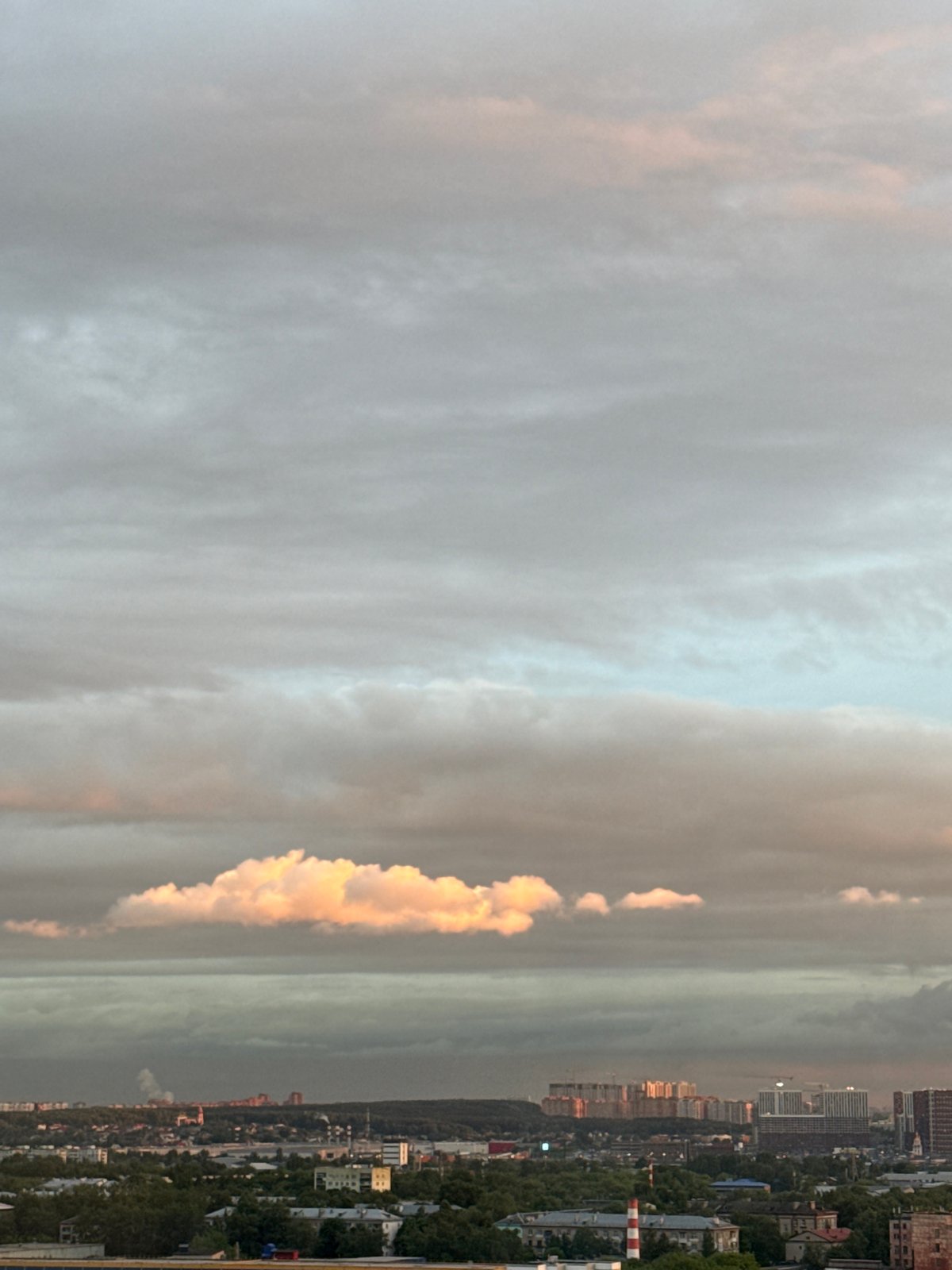 Sunset observed over Lyubertsy cityscape with cloudy skies