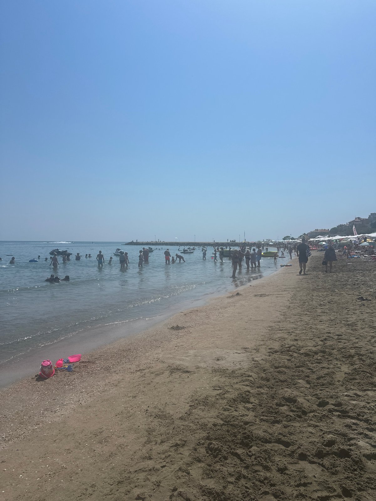 Busy summer morning on the Black Sea beach in Pomorie