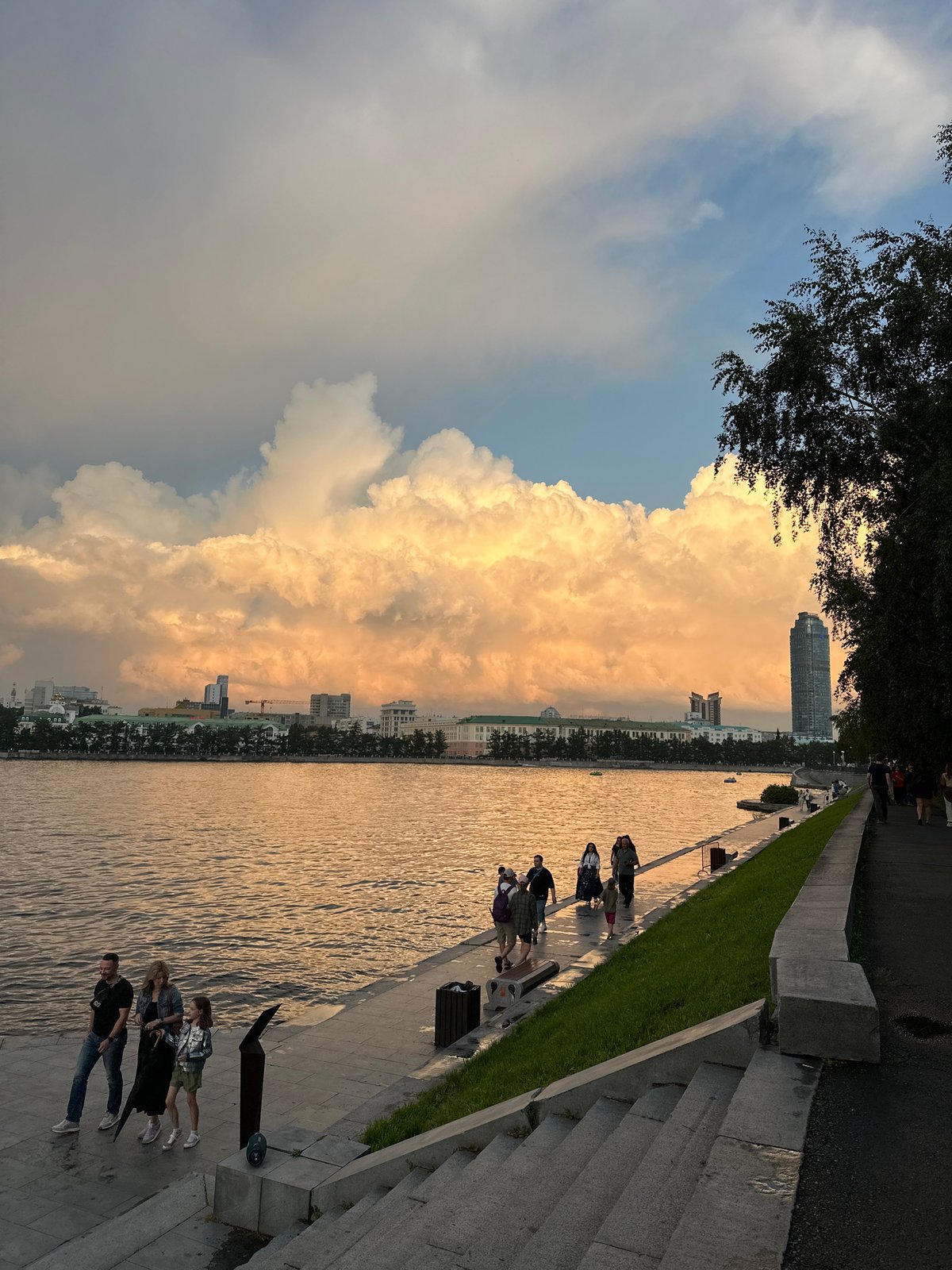 Summer evening on the Yekaterinburg embankment at sunset