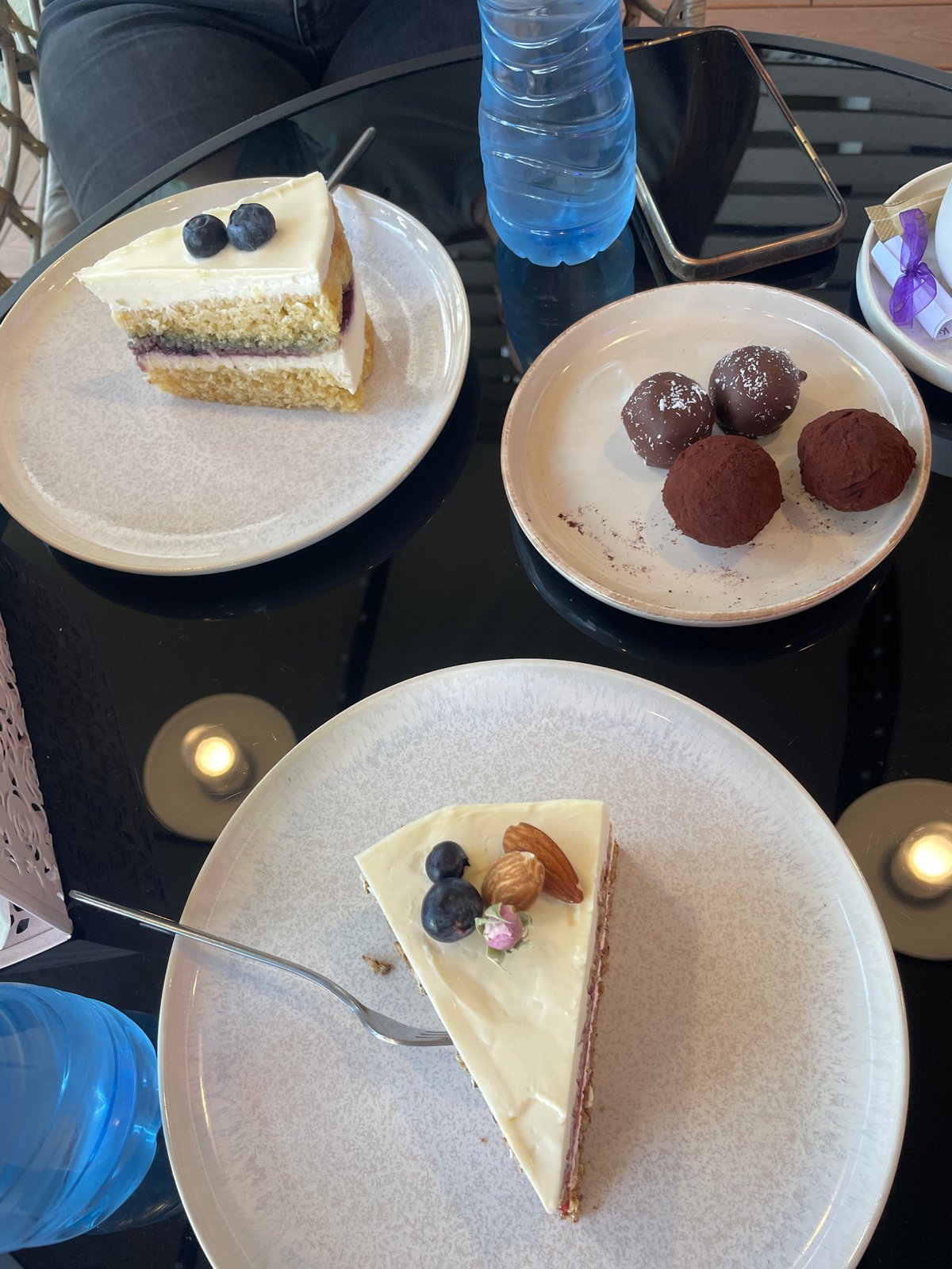 Casual celebration captured at decorated venue with desserts