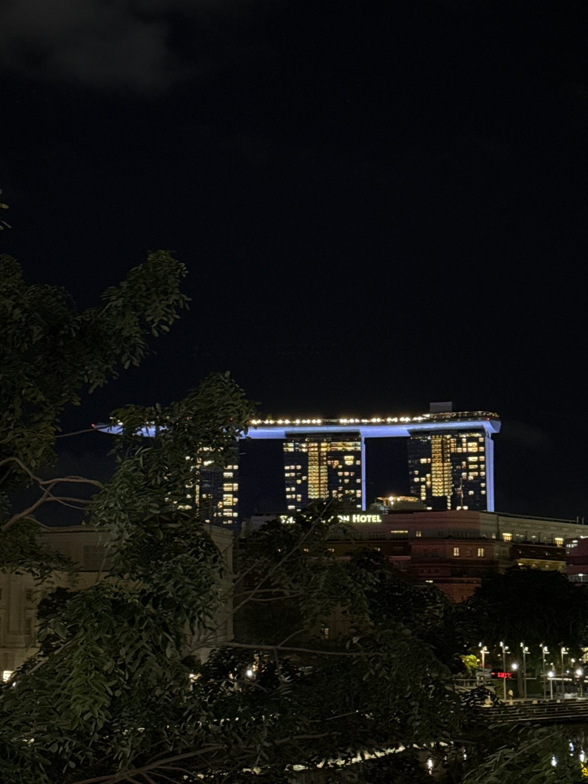 Marina Bay hotels illuminate Singapore skyline at night