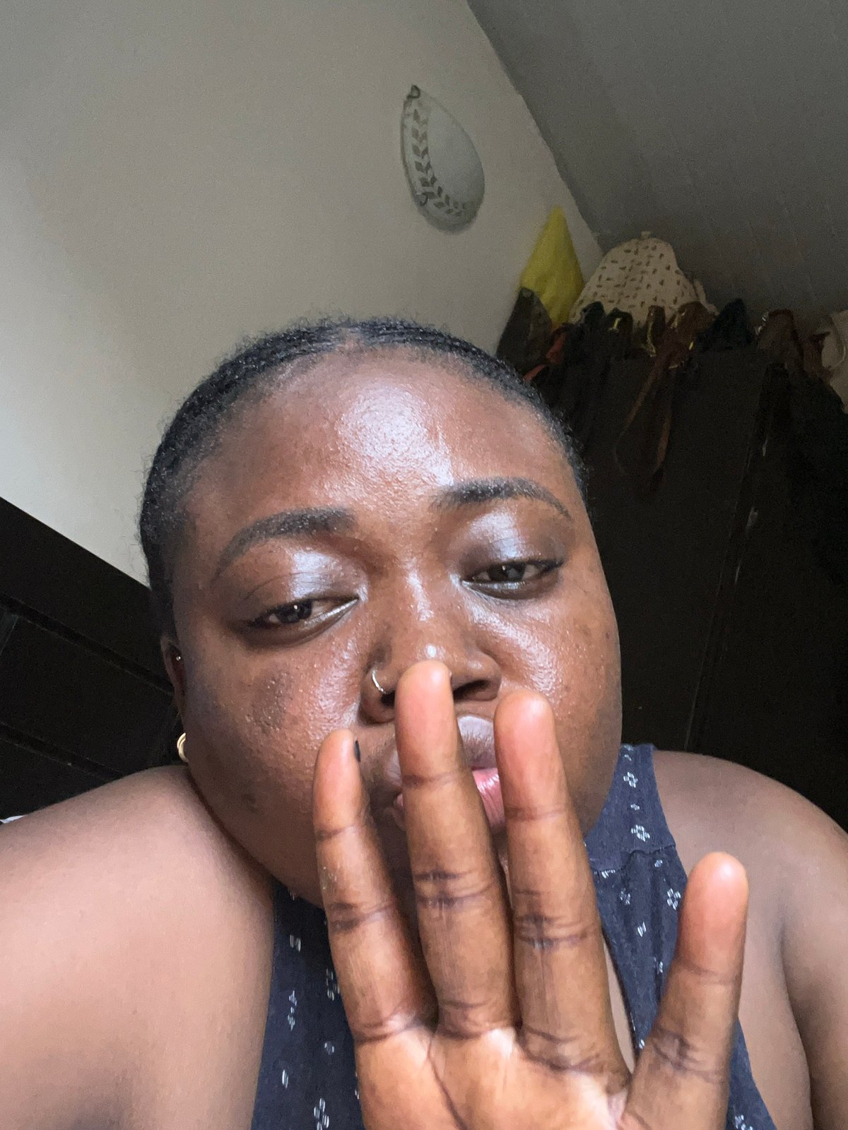 Woman takes selfies in bedroom in Abuja