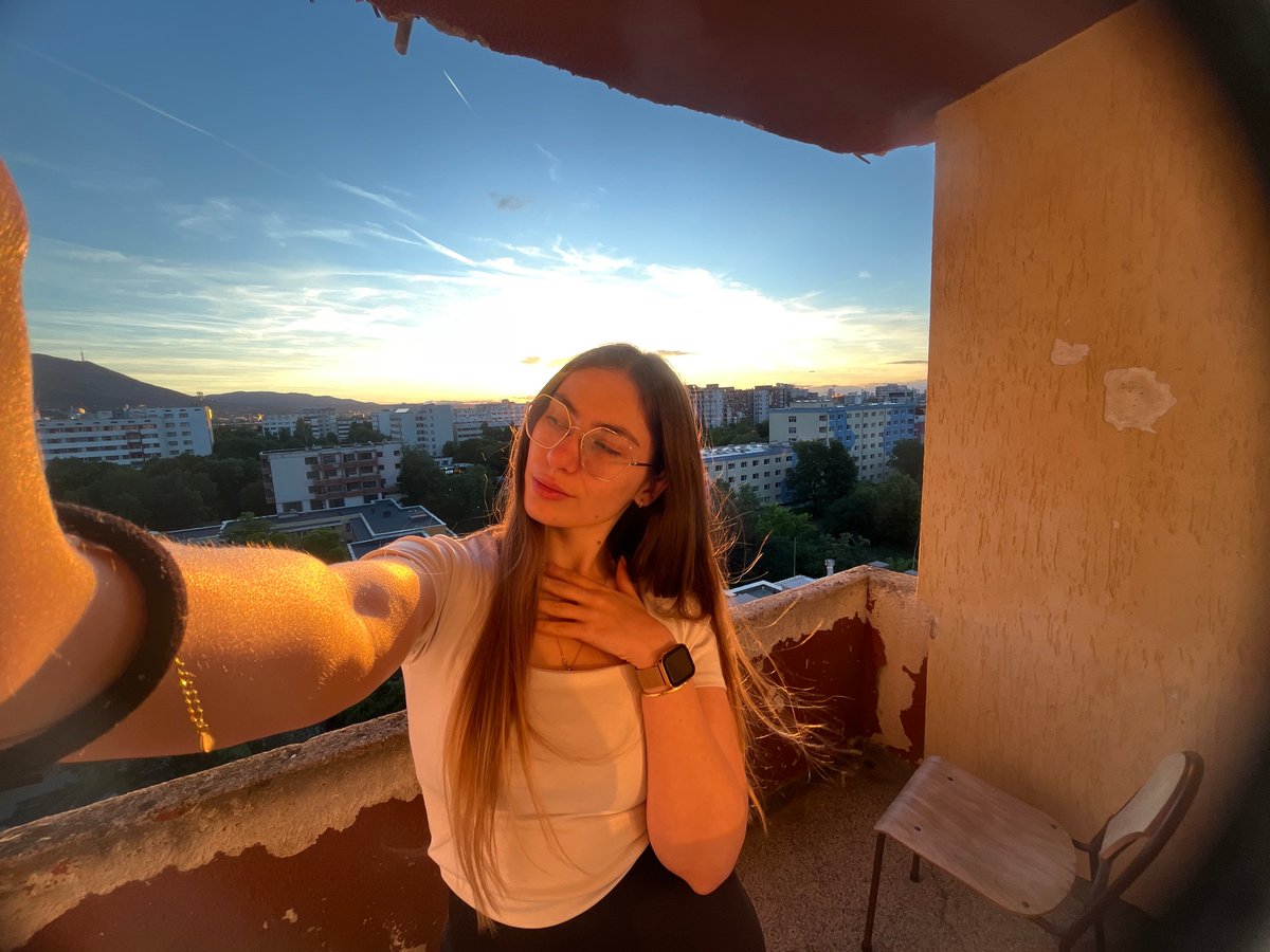 Golden hour photo session on city balcony with multiple angles