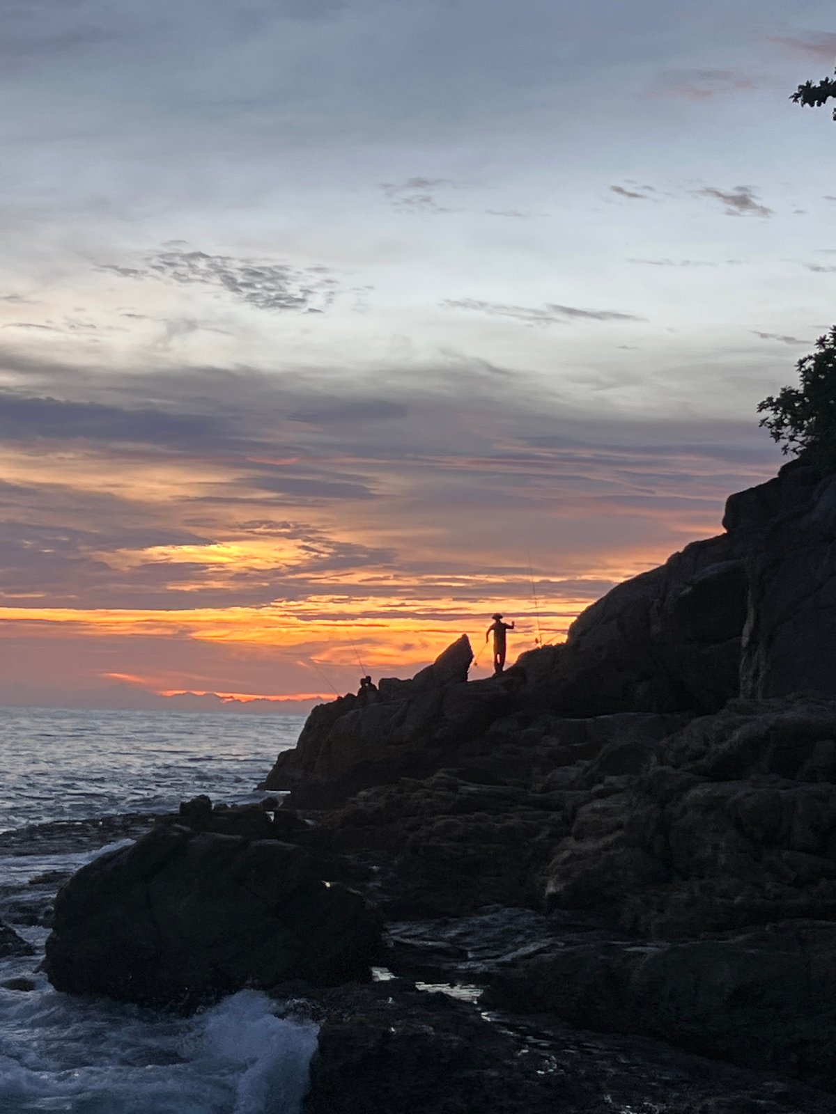 Sunset on the rocks at Choeng Thale's coastline
