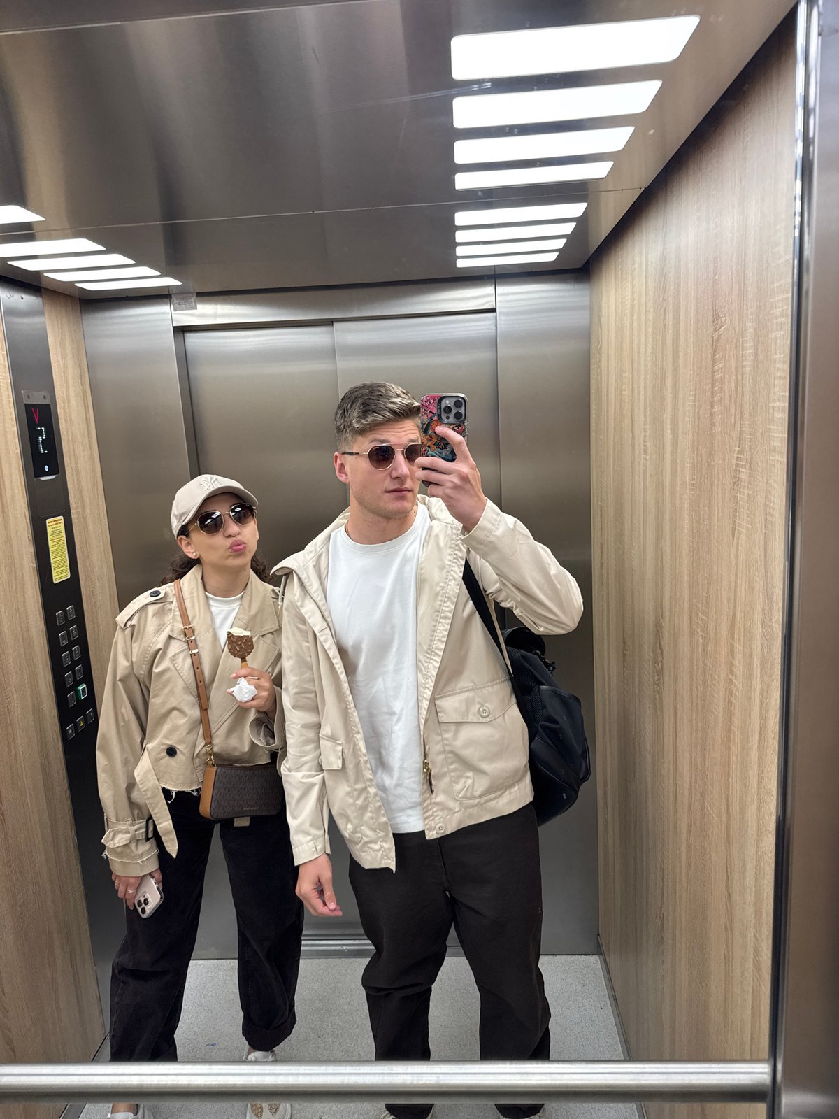 Two people photographed in elevator and outdoors in Plovdiv