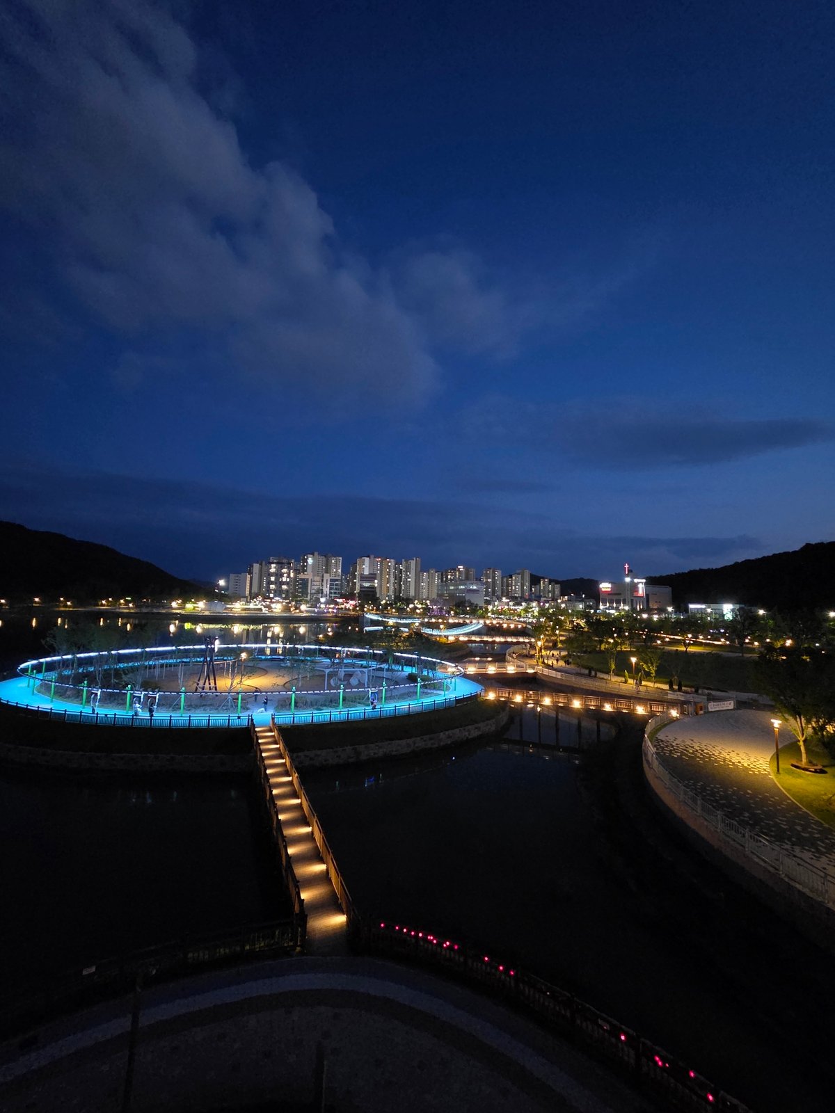 Cartoon sculptures and a suspension bridge at Daejeon lakeside park