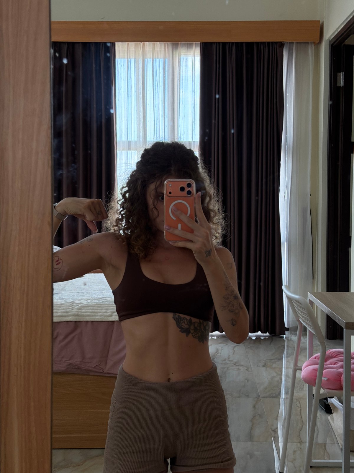 Woman documents morning workout routine in North Kuta bedroom