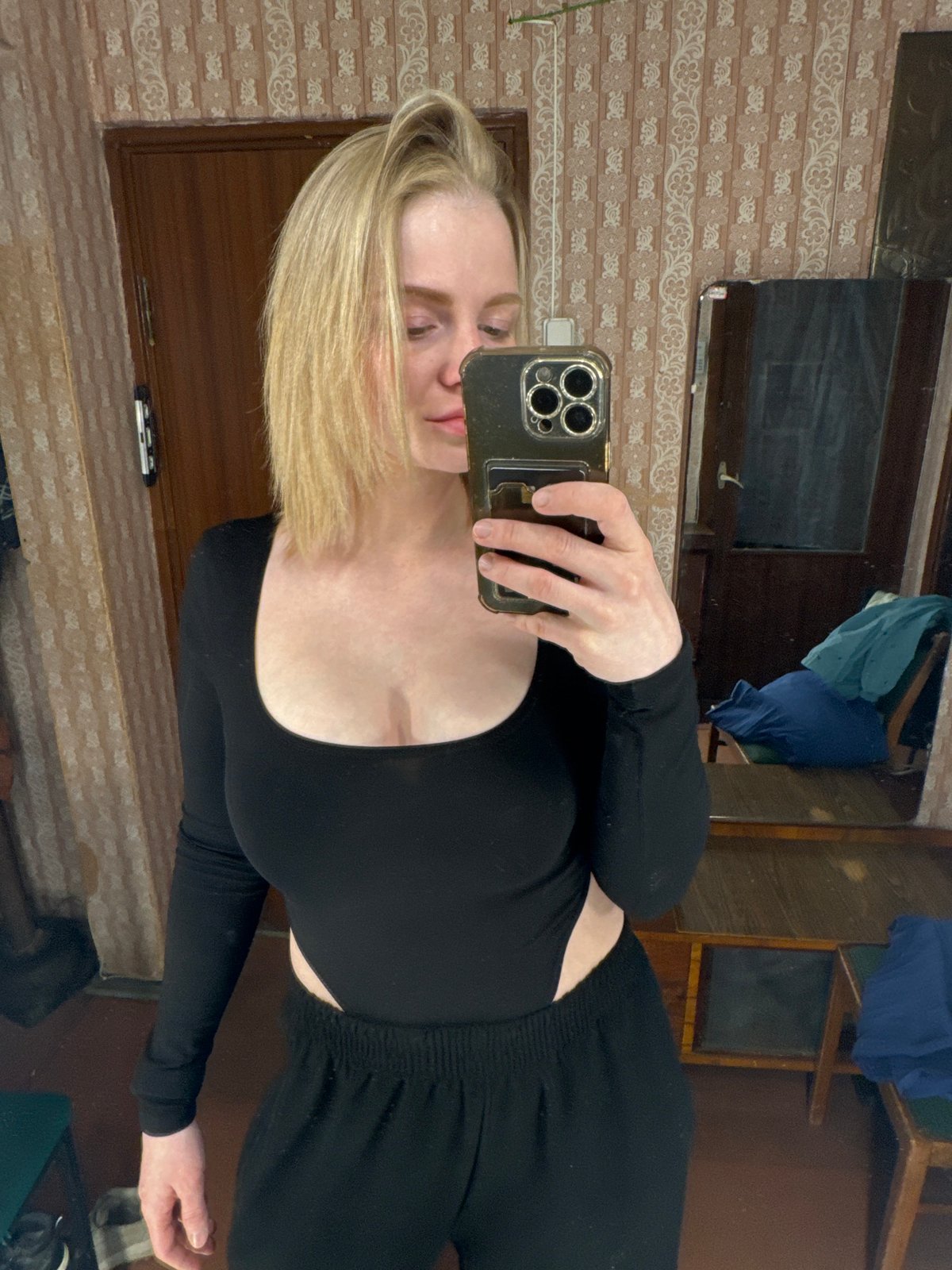 Person takes selfie in decorated room, Saint Petersburg